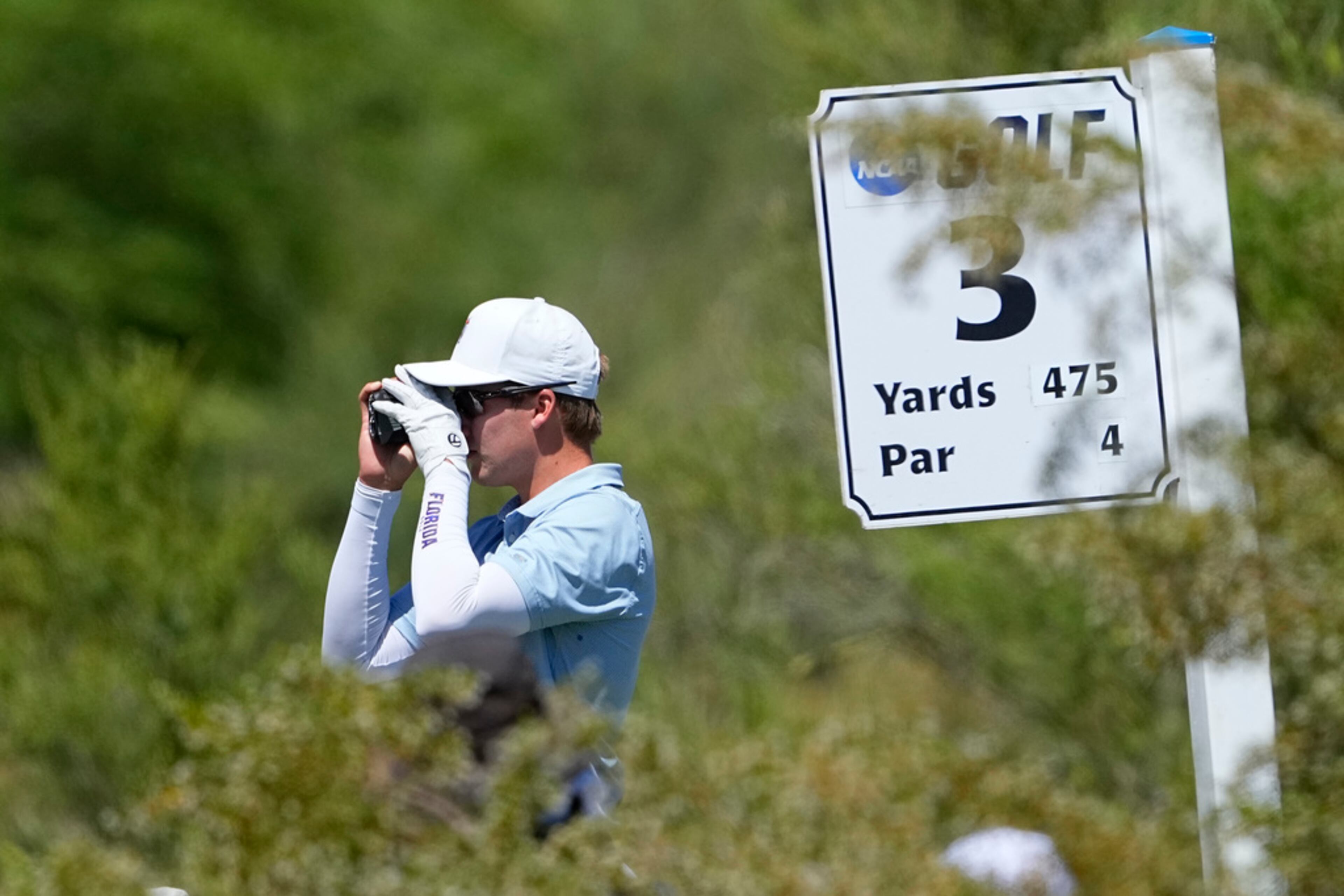 Florida golfer John DeBois looks at his shot for the third tee during the final round of the NCAA college men's match play golf championship, Wednesday, May 31, 2023, in Scottsdale, Ariz. (AP Photo/Matt York)