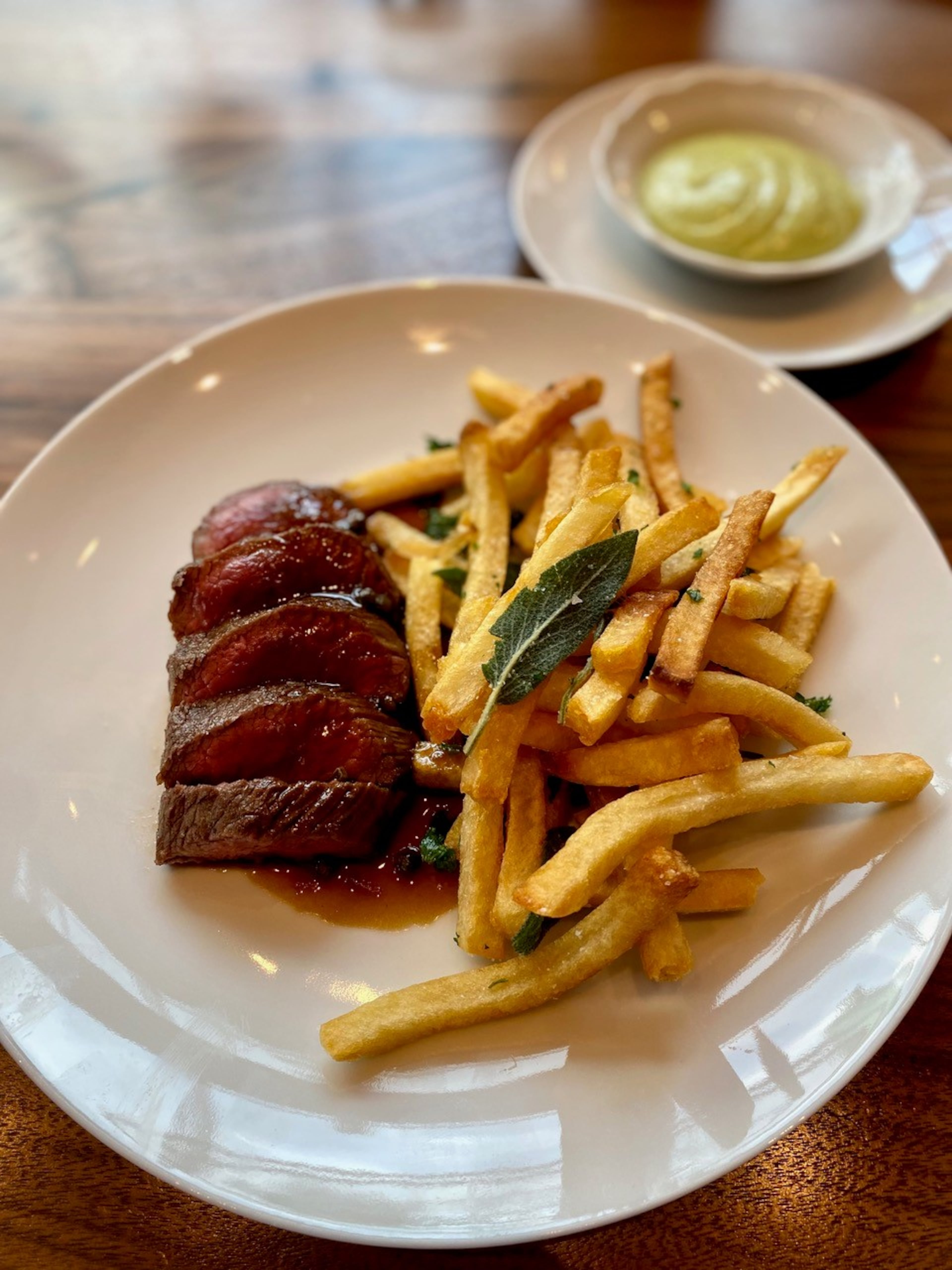 From Lucian’s lunch menu, the classic steak au poivre with fries is pretty near perfect. Wendell Brock for The Atlanta Journal-Constitution