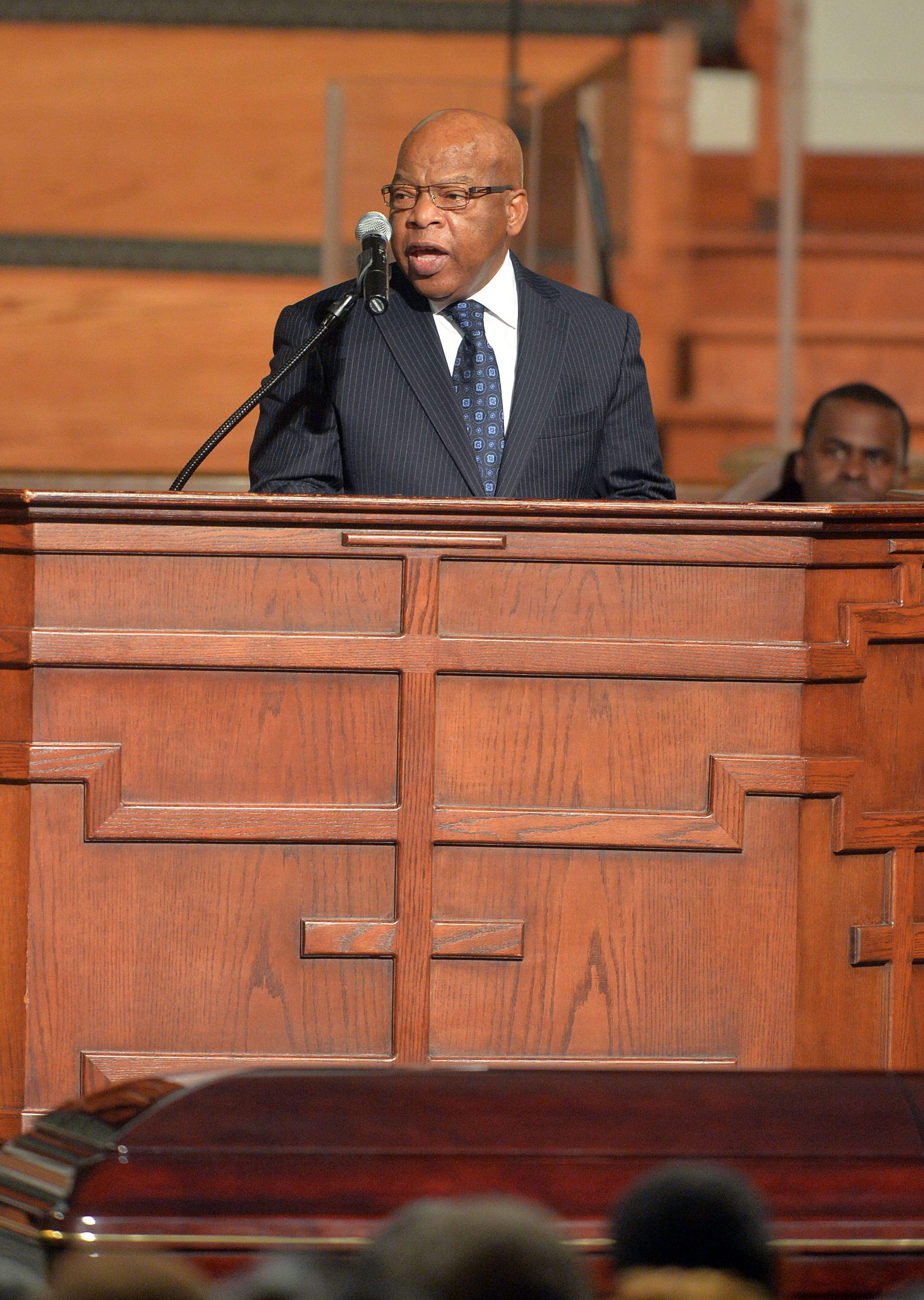 U.S. Rep. John Lewis offers a tribute during the service. Wake for Atlanta builder and civil rights leader Herman J. Russell at Ebenezer Baptist Church Friday, November 21, 2014. Among speakers scheduled were Congressman John Lewis, Congressman David Scott, and Atlanta Mayor Kasim Reed. The Reverend Jesse Jackson Sr and Governor Nathan Deal and his wife Sandra, also attended the service. KENT D. JOHNSON/KDJOHNSON@AJC.COM