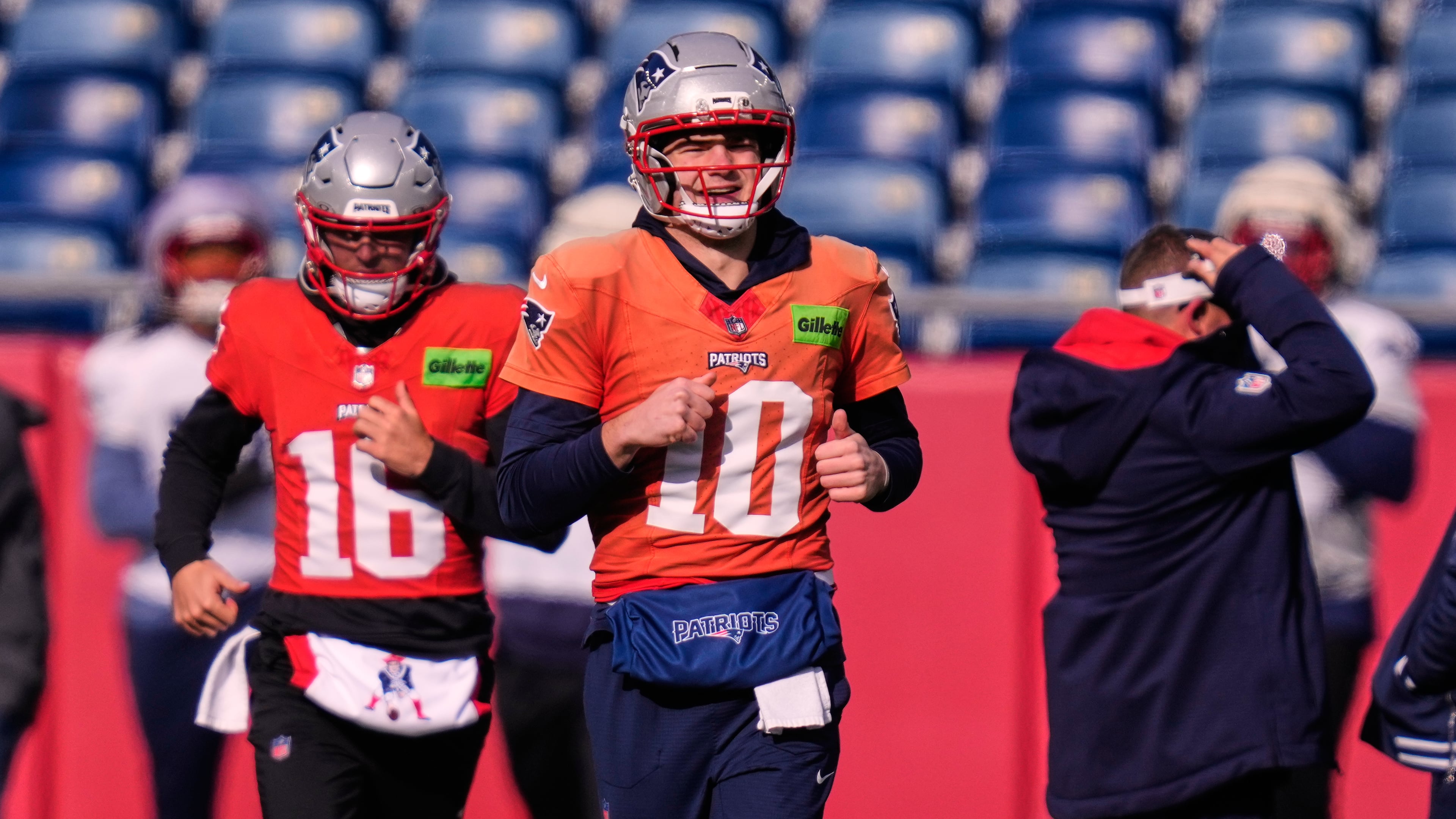 New England Patriots quarterback Drake Maye (10) runs with teammates during a football availability, Friday, Jan. 23, 2026, in Foxborough, Mass. (AP Photo/Charles Krupa)