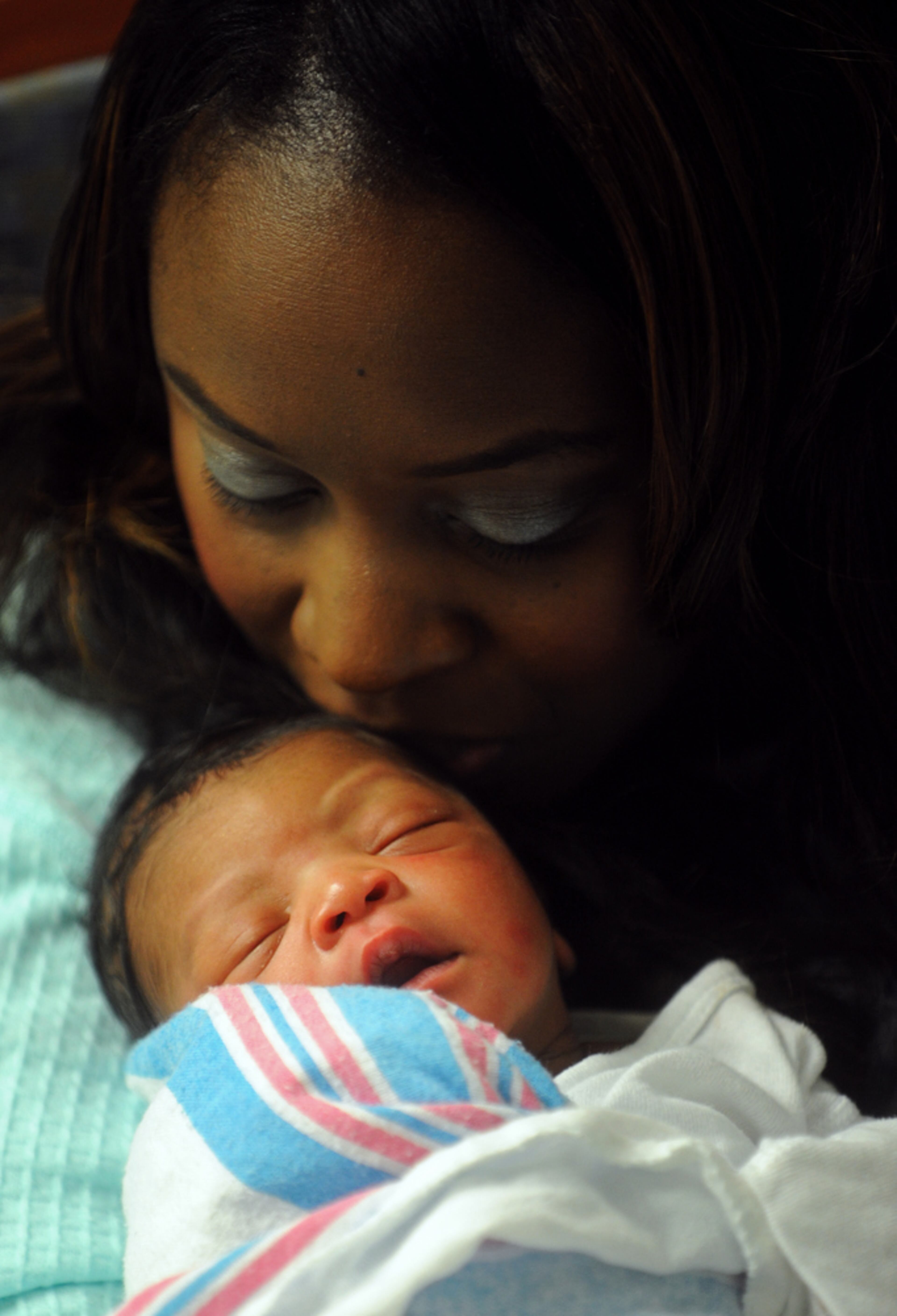Jan. 1, 2013 Atlanta -- Farryn Harrison-Chandler kisses her new son, Farron Curtis Chandler, at Piedmont Hospital in Atlanta Tuesday, Jan. 1, 2013. Chandler was the first baby born in Atlanta in 2013, at exactly midnight, weighing seven pounds, 13 ounces and measuring 19 3/4 inches in length. BITA HONARVAR / BHONARVAR@AJC.COM