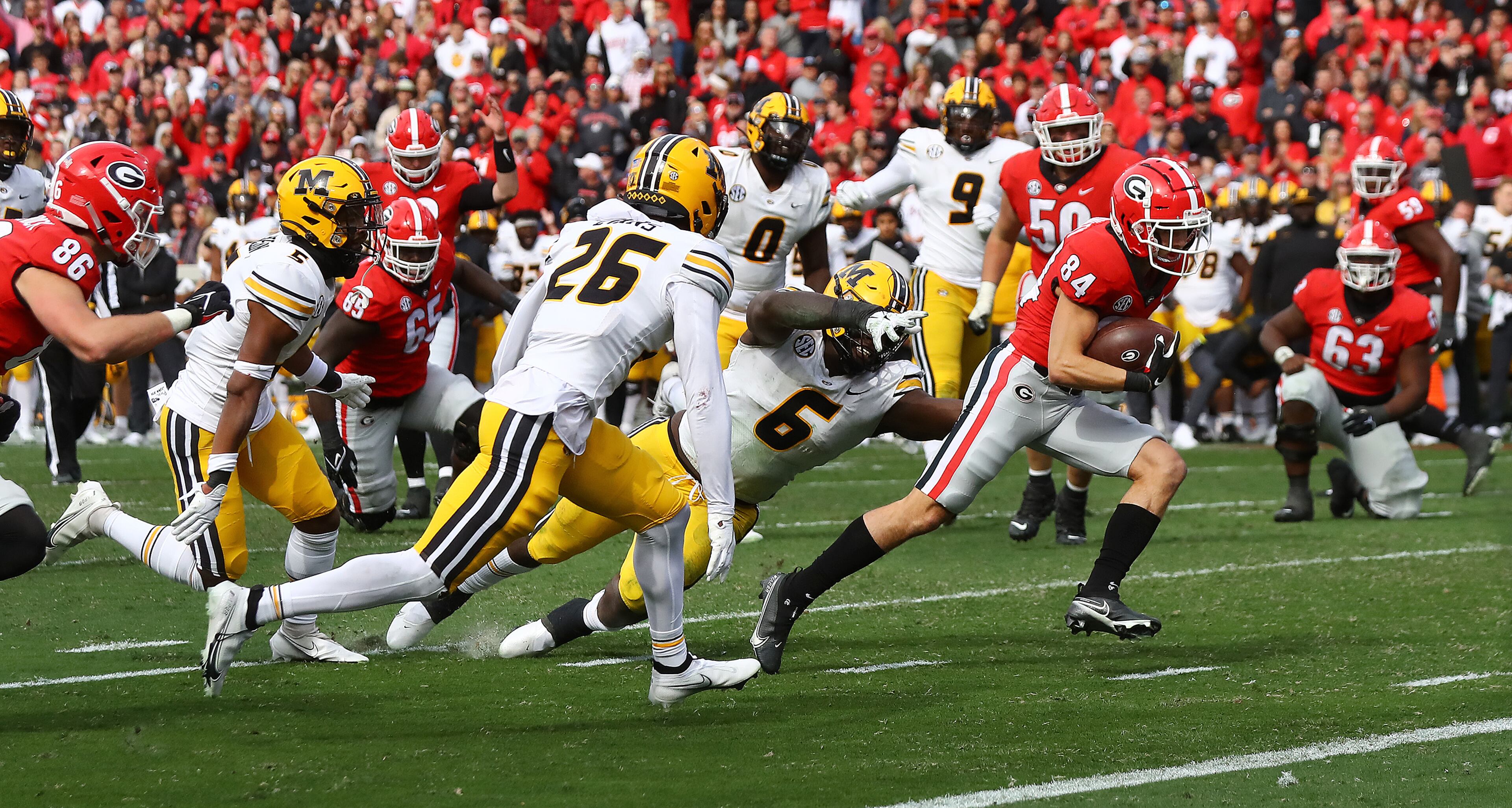 Georgia wide receiver Ladd McConkey catches a pass from JT Daniels and heads to the end zone for a touchdown past Missouri defenders for a 40-3 lead during the third quarter in a NCAA college football game on Saturday, Nov. 6, 2021, in Athens. “Curtis Compton / Curtis.Compton@ajc.com”