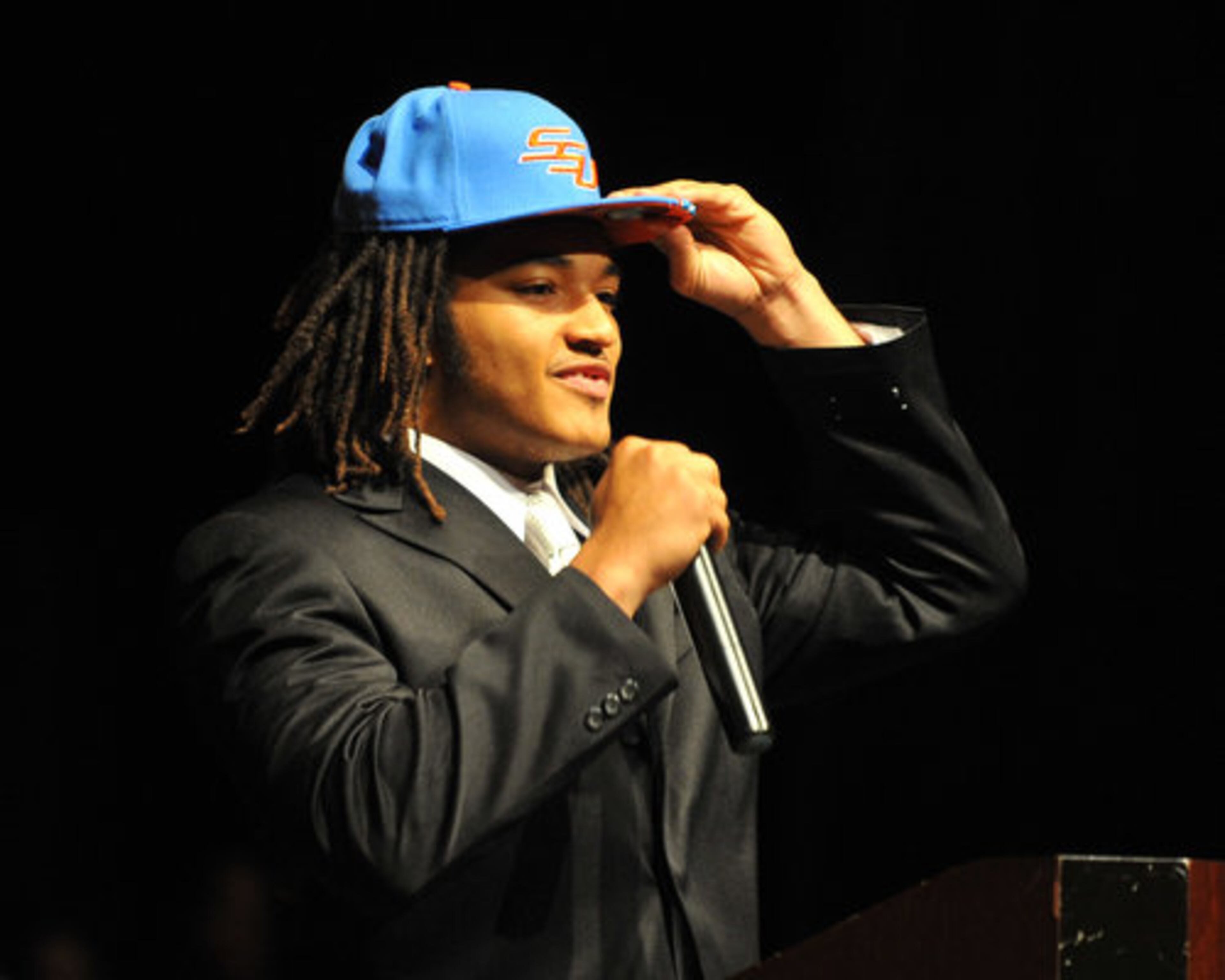 Jordan Miney grabs the bill of his Savannah State hat after announcing he would become a Tiger.