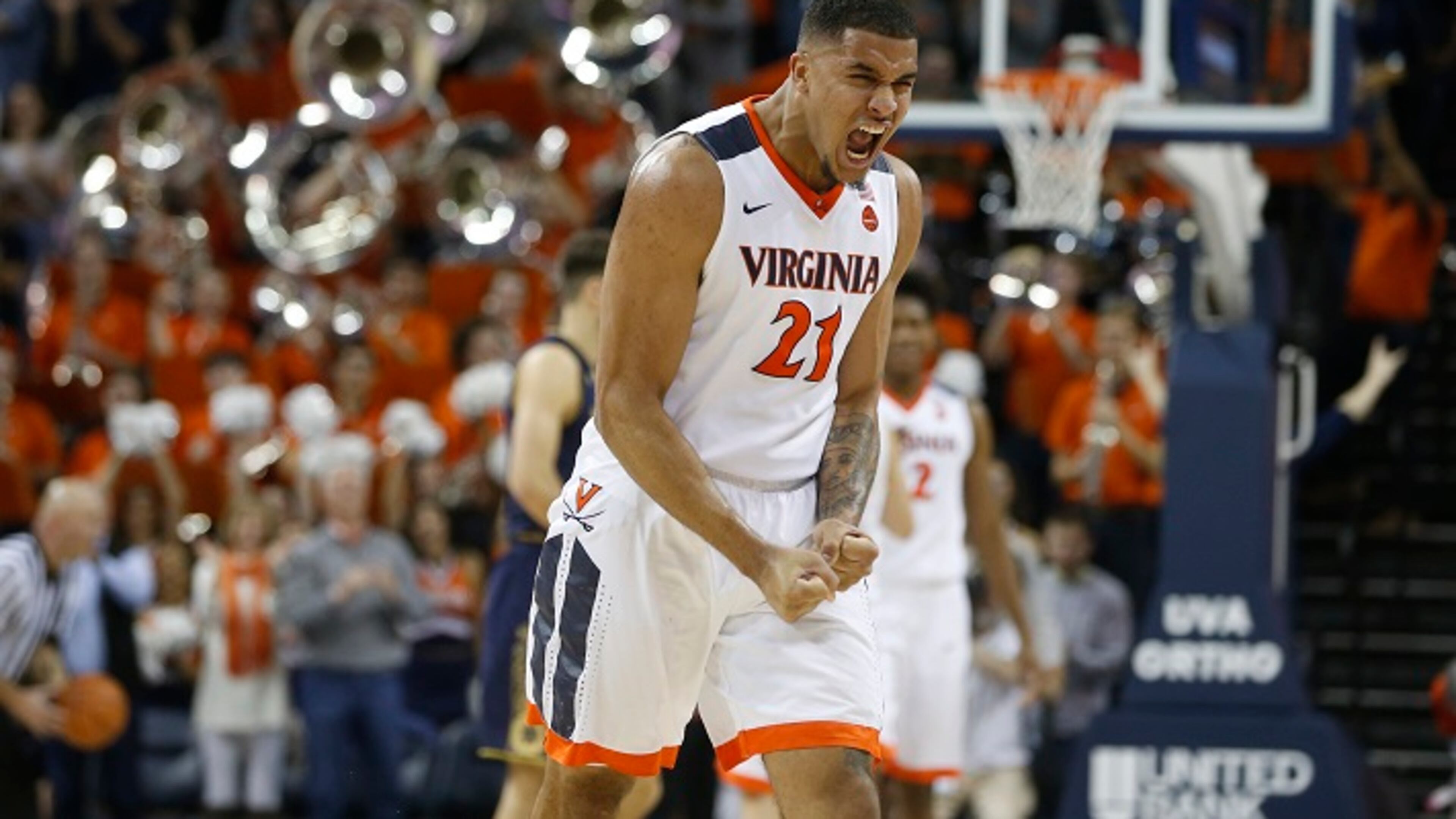 Virginia forward Isaiah Wilkins (21) celebrates his team's 62-57 win at the end of an NCAA college basketball game in Charlottesville, Va., Saturday, March 3, 2018. Virginia won the game 62-57. (AP Photo/Steve Helber)