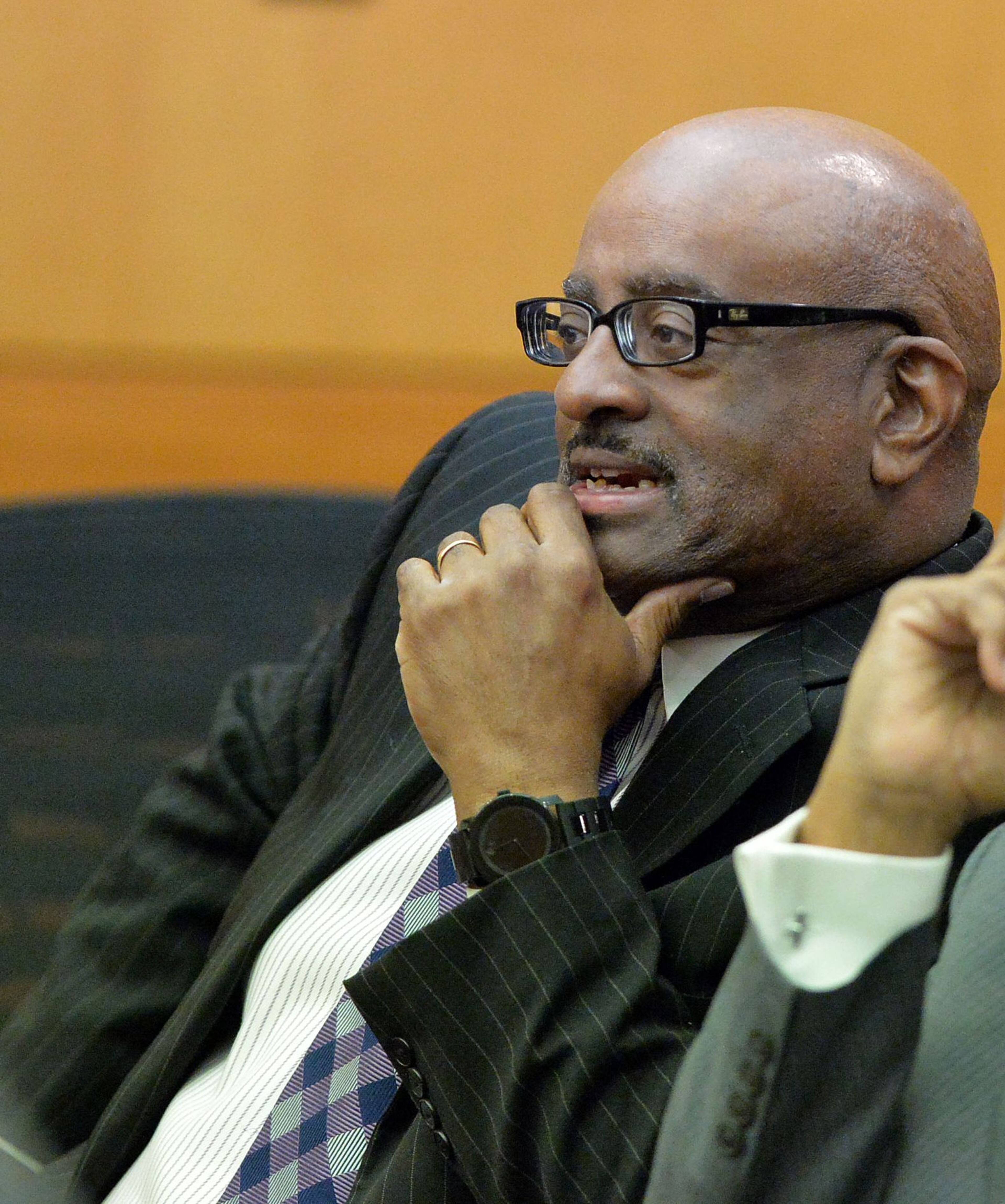 In this March 31, 2015 file photo, former APS SRT Director Michael Pitts and his defense attorney George Lawson talk as a jury question is announced in court Tuesday. A jury of six men and six women deliberate for a seventh day in the Atlanta Public Schools test-cheating trial on Tuesday, March 31, 2015. A quick verdict is unlikely as the jurors enter their second full week of deliberations as they sort through roughly five months of testimony against 12 former educators accused of engaging in a racketeering conspiracy to inflate test scores.