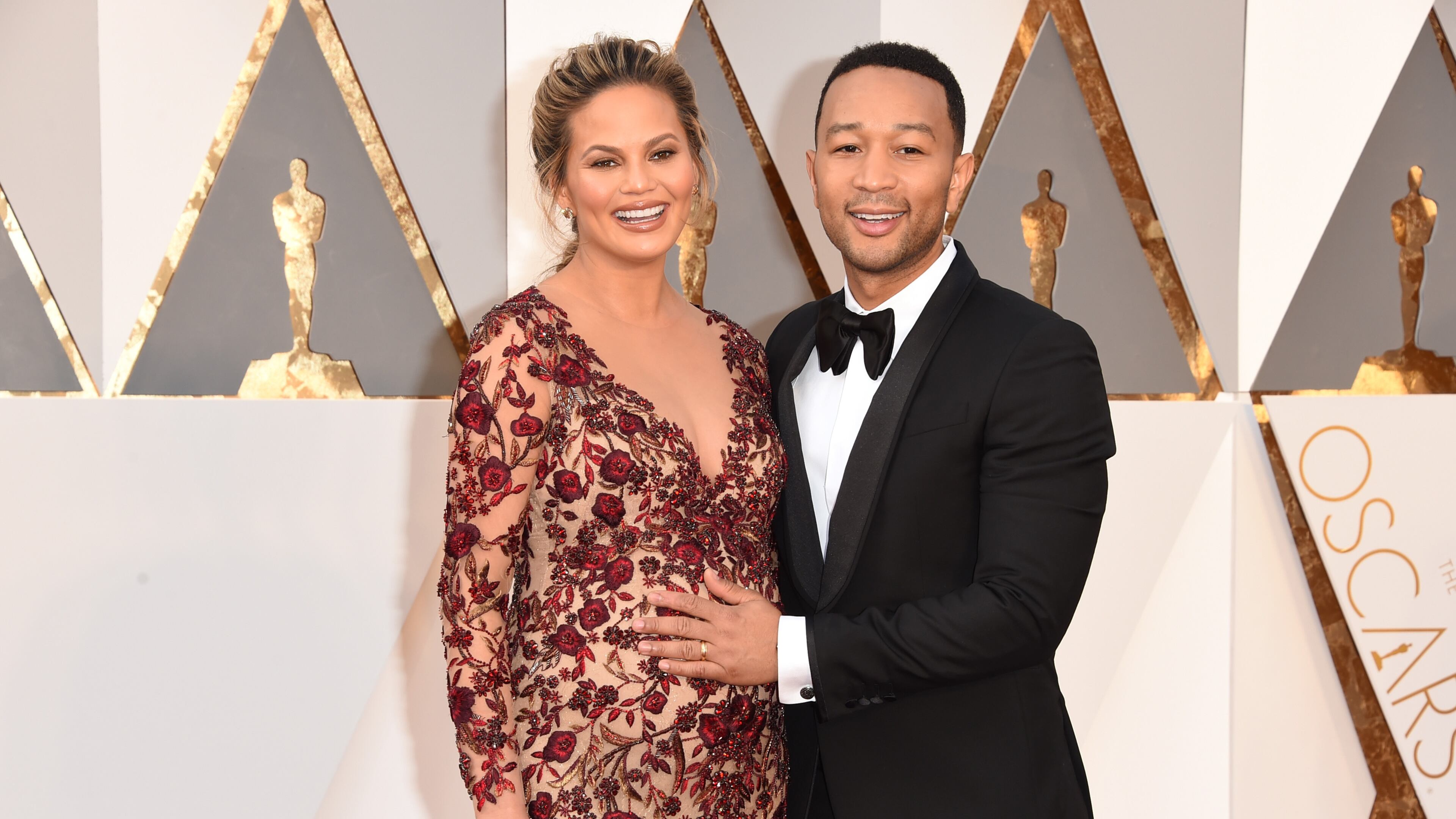 HOLLYWOOD, CA - FEBRUARY 28: Model Chrissy Teigen (L) and recording artist John Legend attend the 88th Annual Academy Awards at Hollywood & Highland Center on February 28, 2016 in Hollywood, California. (Photo by Jason Merritt/Getty Images)