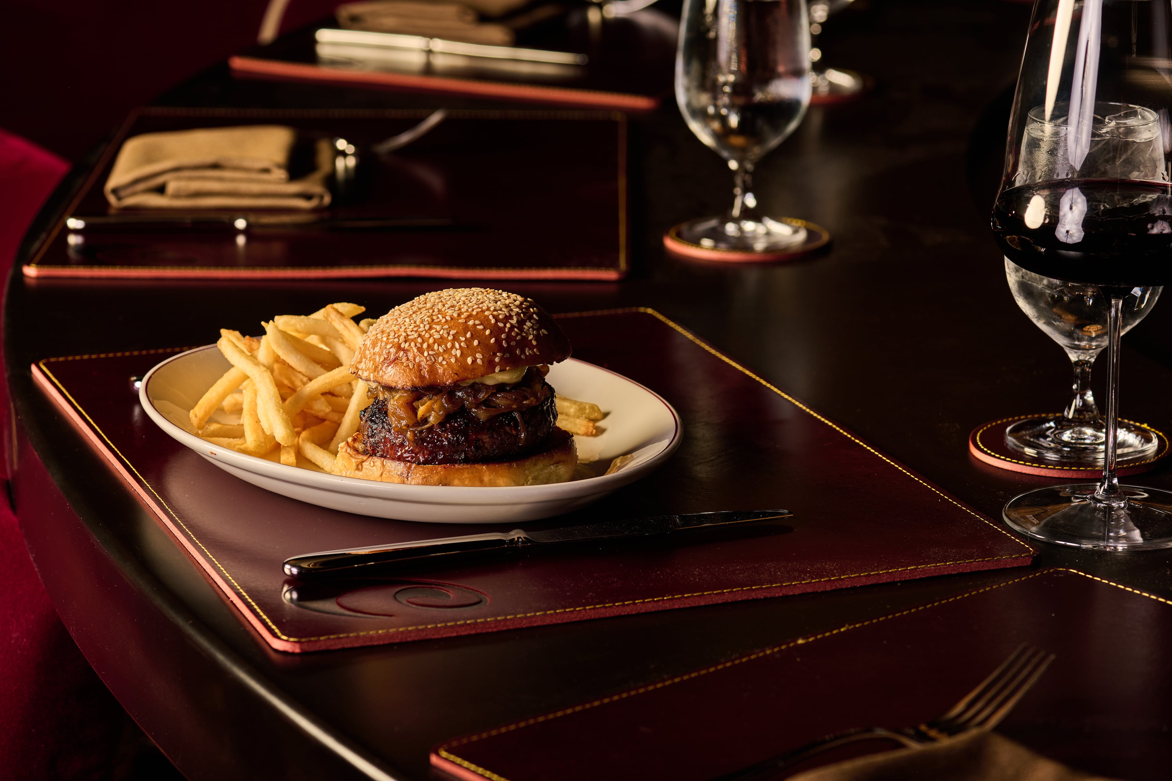 The C's 8-ounce prime dry-aged burger is slathered in immensely rich Coca-Cola caramelized onions. (Angie Webb/Courtesy of Clark's Steakhouse)