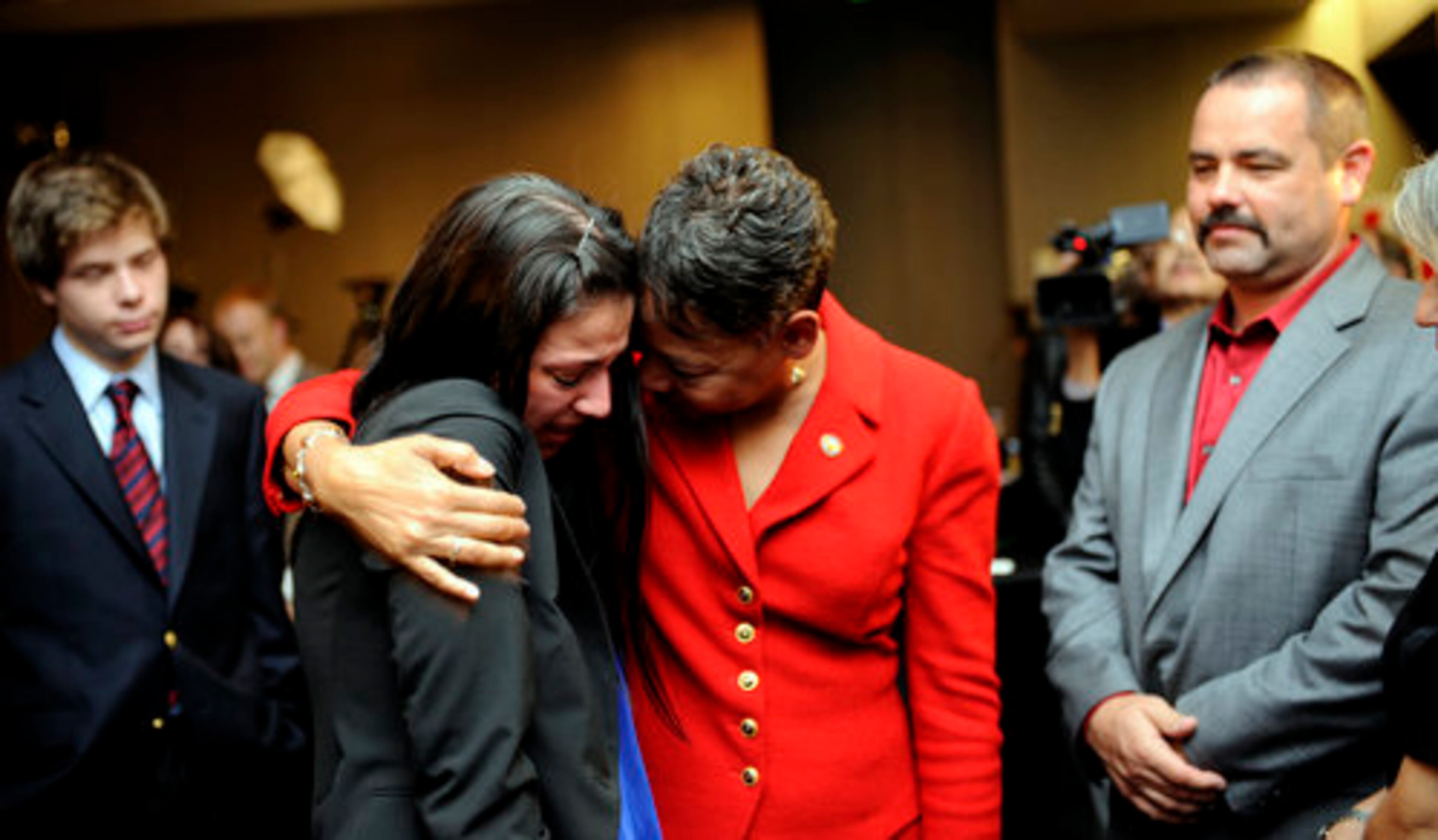 An emotional Lisa Borders hugs staff member Whitney Luallen after making her concession speech