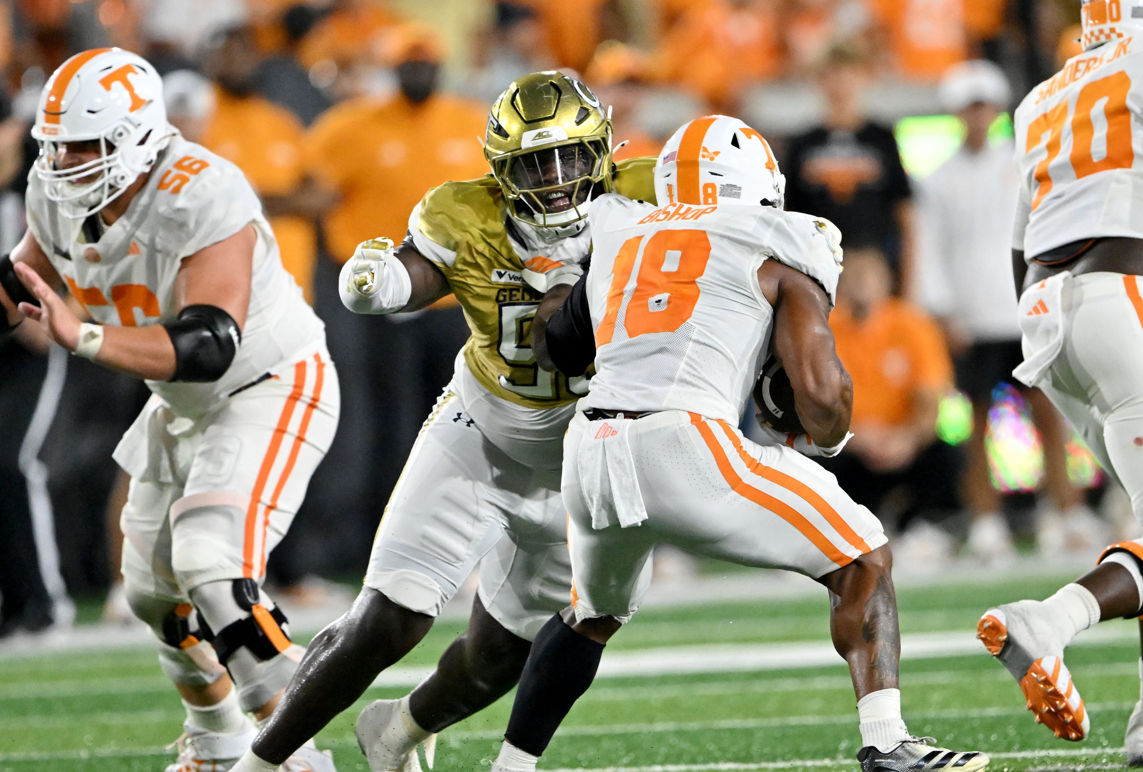 Tennessee running back DeSean Bishop (18) is stopped by Georgia Tech defensive lineman Tawfiq Thomas (95) during the second half in an NCAA college football game at Bobby Dodd Stadium on Saturday, Sept. 12, 2026, in Atlanta. Tennessee defeated Georgia Tech 45-24. (Hyosub Shin/AJC)
