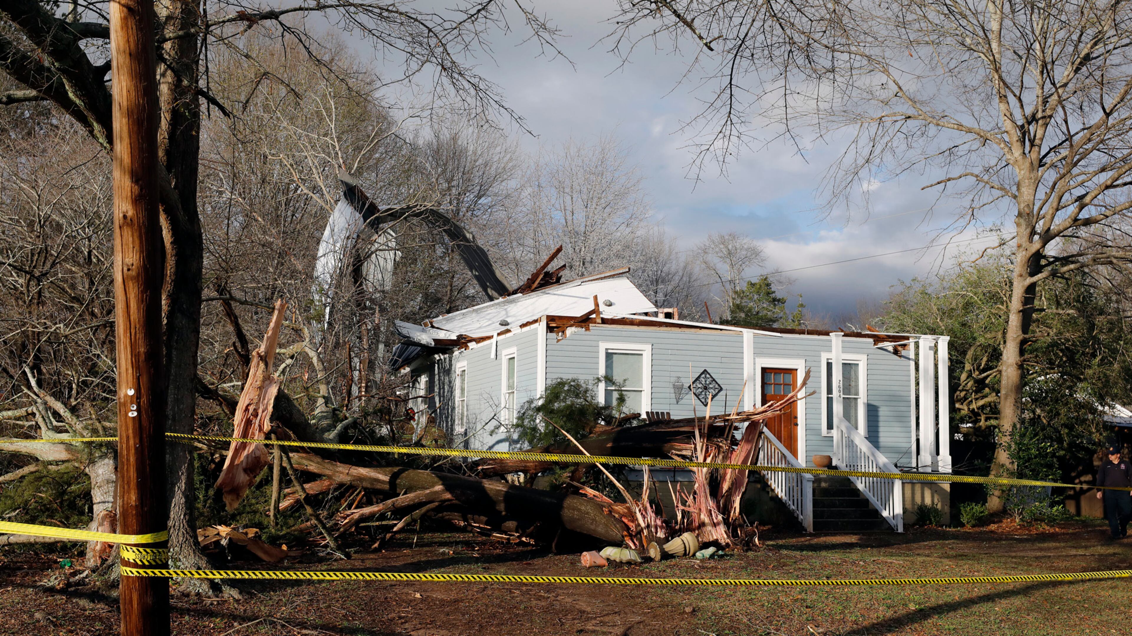 Debris lies on the ground at the home of Ellen Green and Johnny Green on Sunday, Jan. 22, 2017 in Opelika, Ala. The National Weather Service said Sunday that southern Georgia, northern Florida and the corner of southeastern Alabama could face "intense and long track" tornadoes, scattered damaging winds and large hail. (Todd J. Van Emst/Opelika-Auburn News via AP)