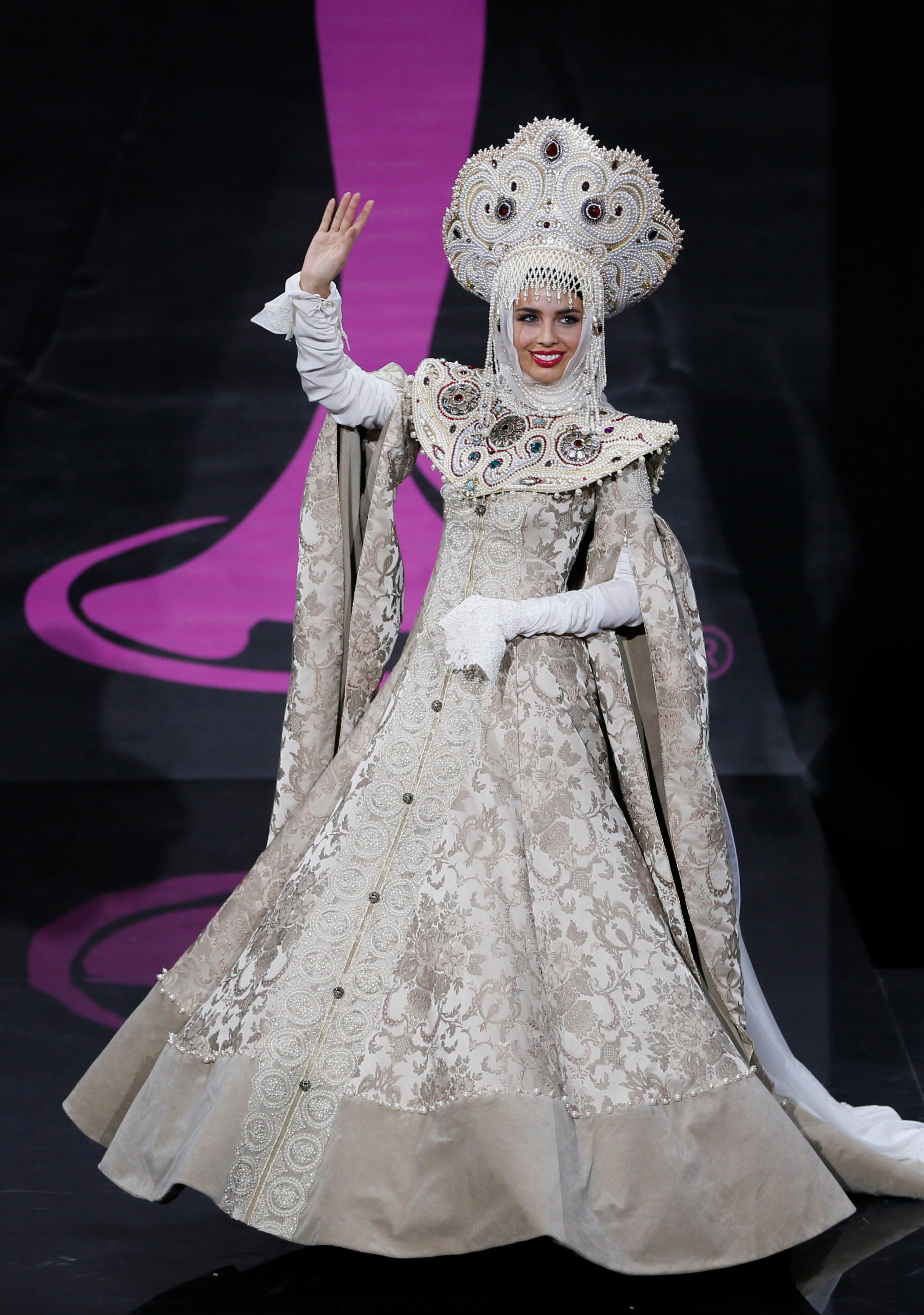 Miss Russia Elmira Abdrazakova presents her outfit, during the national costume show at the 2013 Miss Universe pageant in Moscow, Russia, on Sunday, Nov. 3, 2013. Beauties will compete for the title of Miss Universe in Moscow on Nov. 9. (AP Photo/Pavel Golovkin)