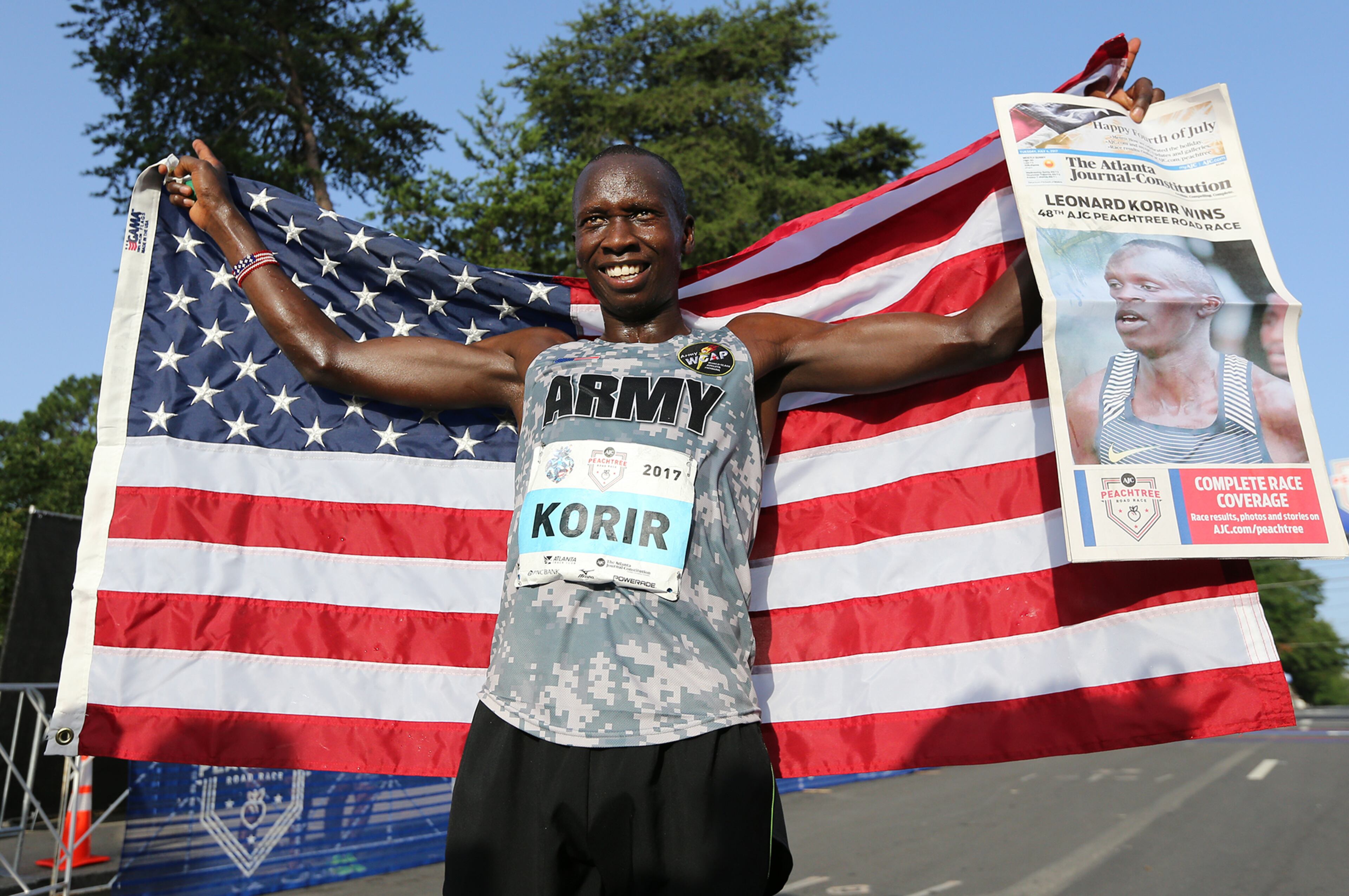 July 04, 2017 Atlanta: Leonard Korir celebrates winning the 48th running of the 6.2 mile AJC Peachtree Road Race with an unofficial time of 28:16 on Tuesday, July 4, 2017, in Atlanta. Curtis Compton/ccompton@ajc.com
