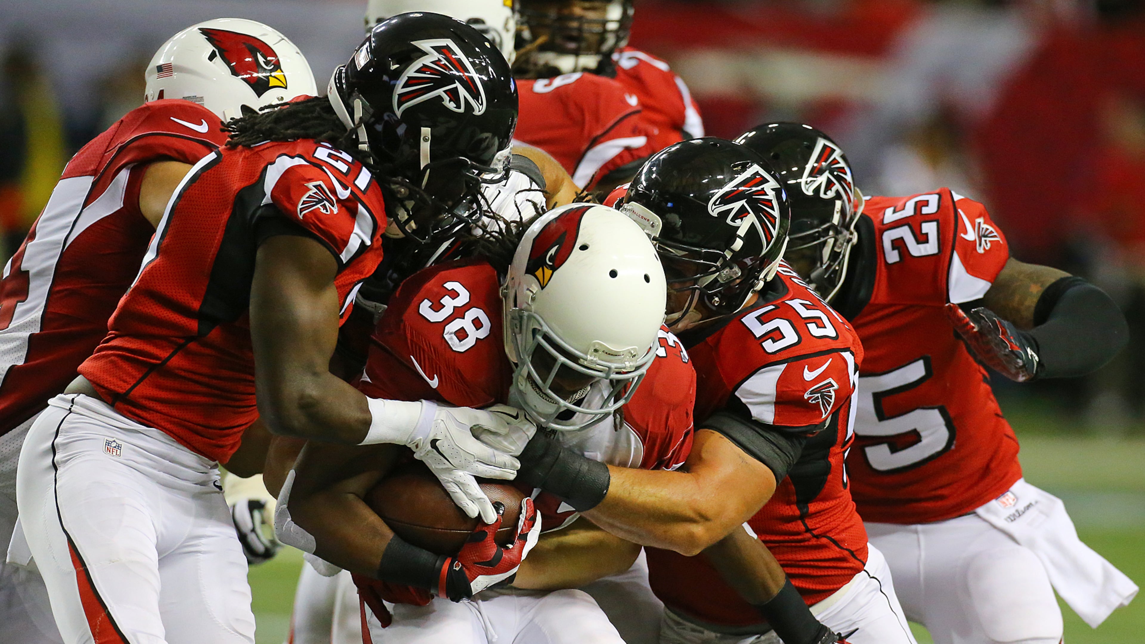113014 ATLANTA: Falcons defenders Desmond Trufant ( left) and Paul Worrilow stop Cardinals running back Andre Ellington for a short gain during the first half in an NFL football game on Sunday, Nov. 30, 2014, in Atlanta. CURTIS COMPTON / CCOMPTON@AJC.COM 113014 ATLANTA: Falcons defenders Desmond Trufant ( left) and Paul Worrilow stop Cardinals running back Andre Ellington for a short gain during the first half in an NFL football game on Sunday, Nov. 30, 2014, in Atlanta. CURTIS COMPTON / CCOMPTON@AJC.COM