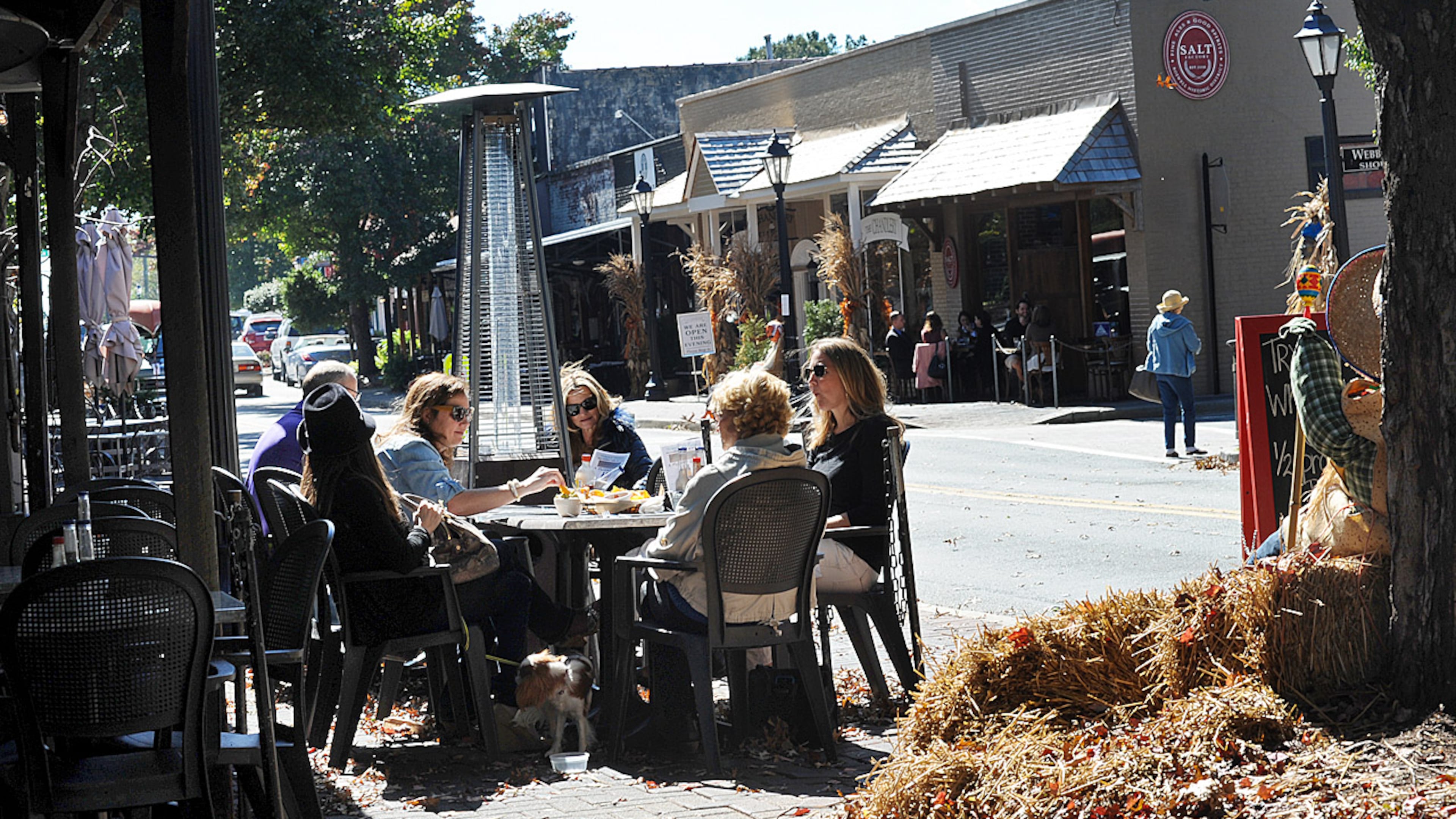 Diners sit outside Little Alley Steak, across the road from Opulent and Salt. Canton Street is the heart of Roswell’s dining district.
