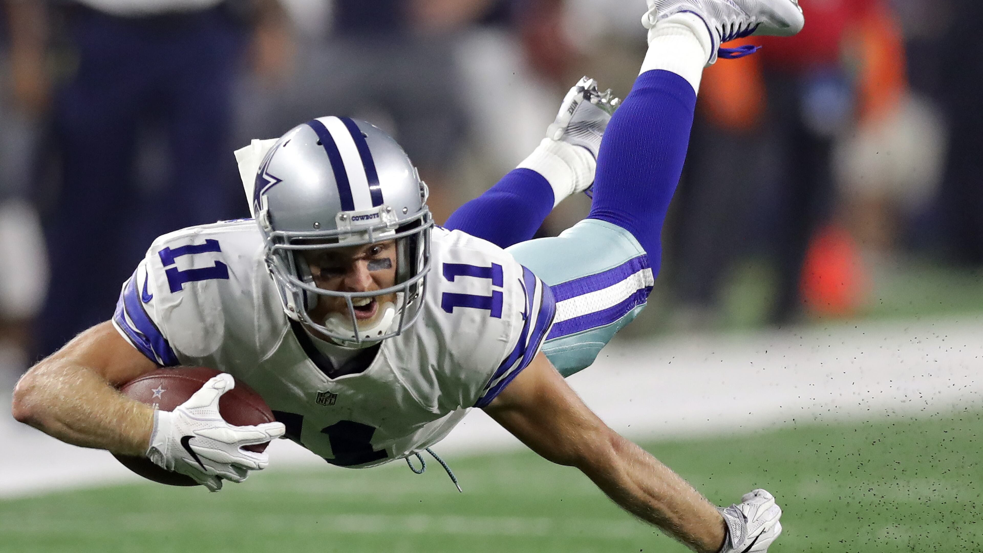 ARLINGTON, TX - SEPTEMBER 25: Cole Beasley #11 of the Dallas Cowboys dives for extra yards in the second quarter against the Chicago Bears at AT&T Stadium on September 25, 2016 in Arlington, Texas. (Photo by Ronald Martinez/Getty Images)