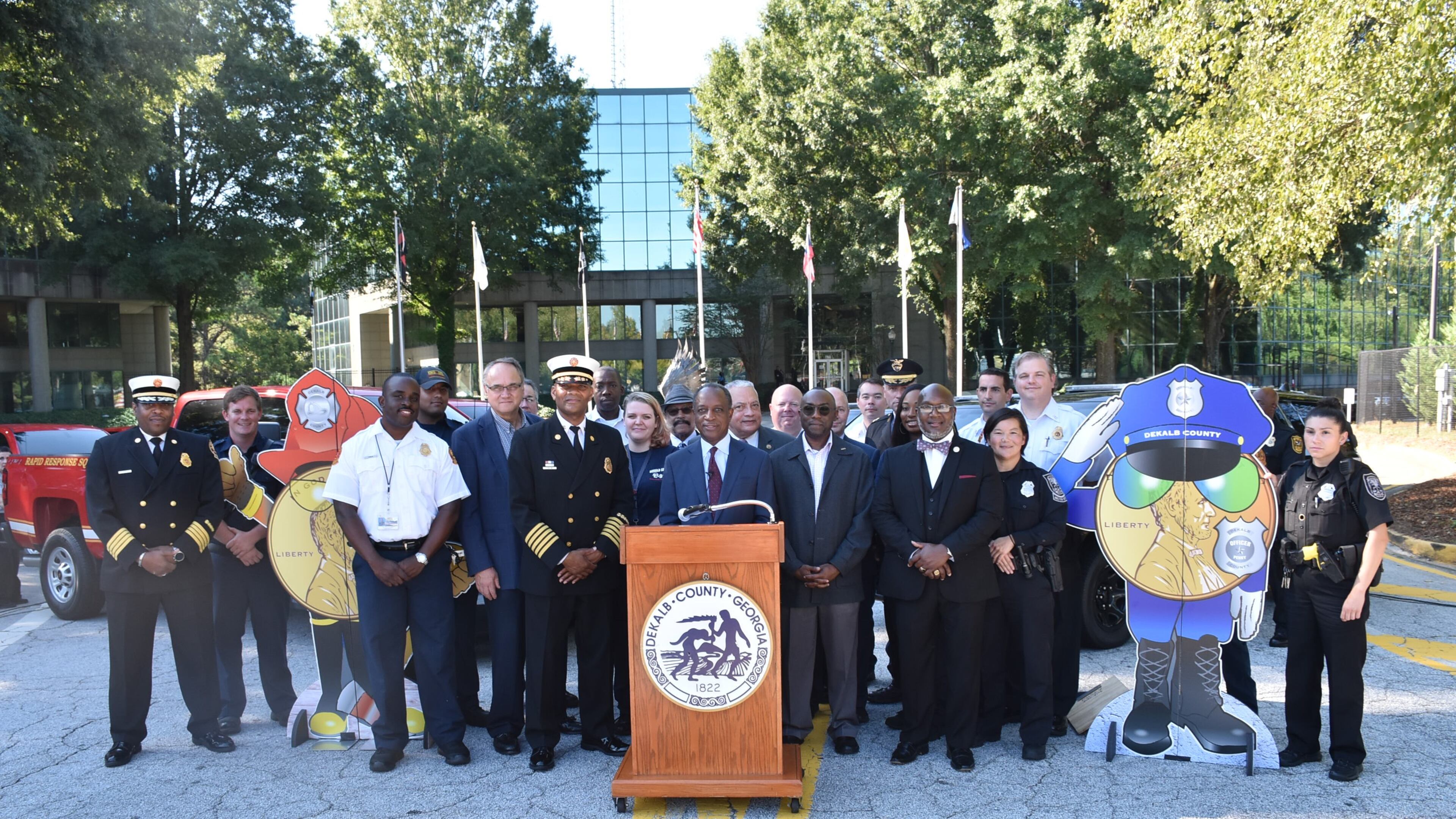 CEO Thurmond, county commissioners and public safety staff at the Sept. 19 press conference revealing new police and fire rescue vehicles purchased with SPLOST funds. CONTRIBUTED