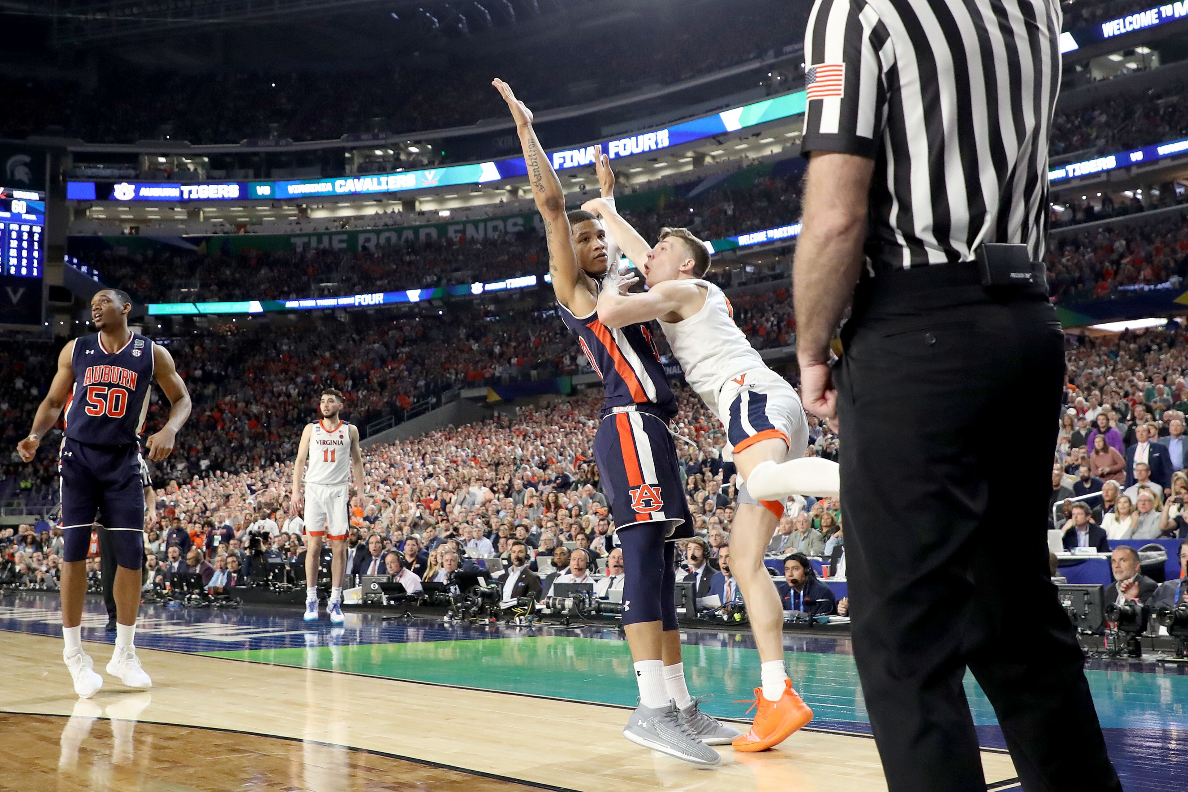 With his team down by two points, Kyle Guy of Virginia attempted a three-pointer as time expired. A foul was called on Auburn's Samir Doughty. Guy made all three free throws and the Cavs advanced to the national championship game. (Photo by Streeter Lecka/Getty Images)