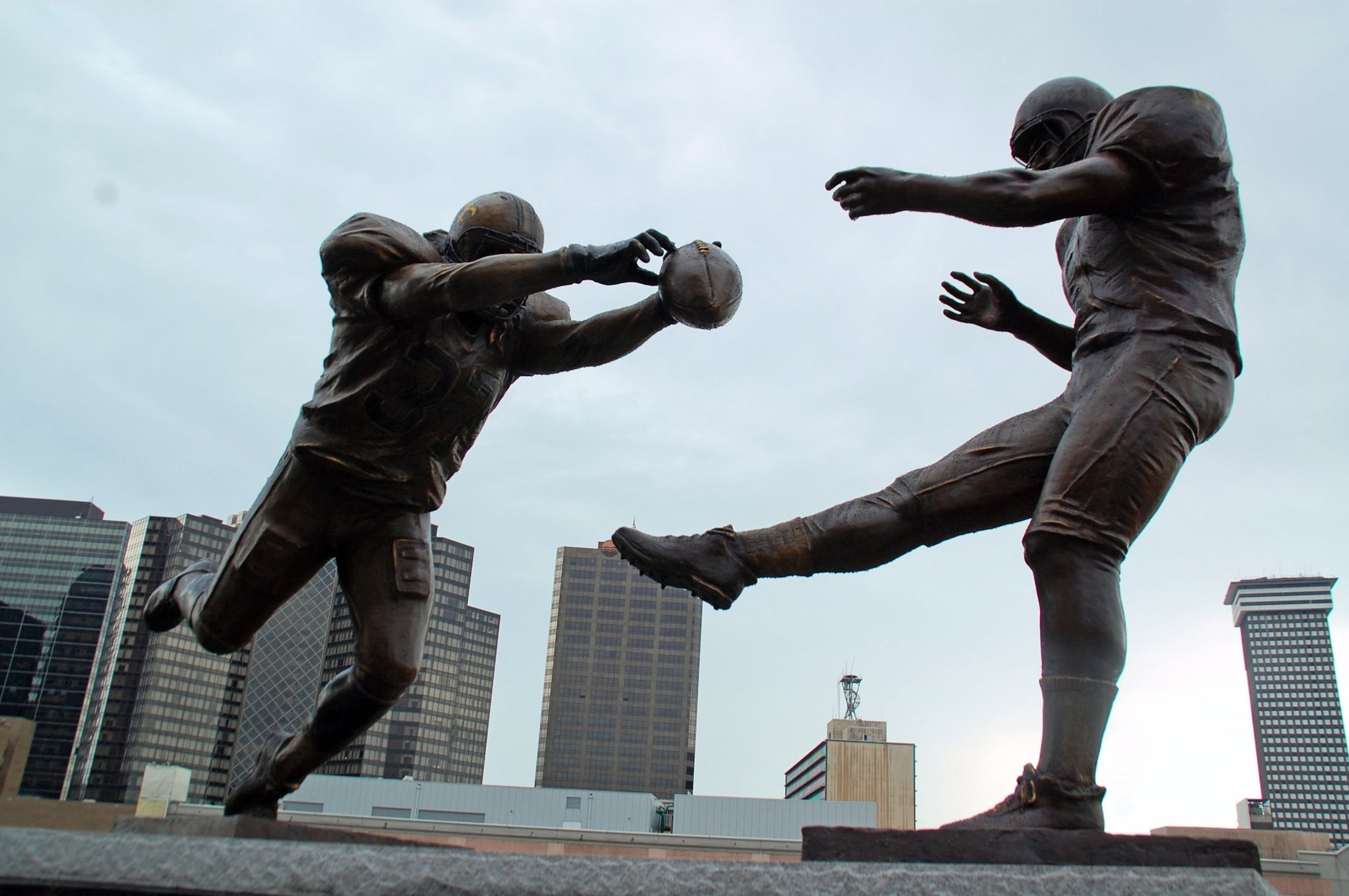 The memory of New Orleans’ Steve Gleason blocking a punt from the Falcons’ Michael Koenen in 2006 lives in a sculpture titled “Rebirth.” (AJC file photo)