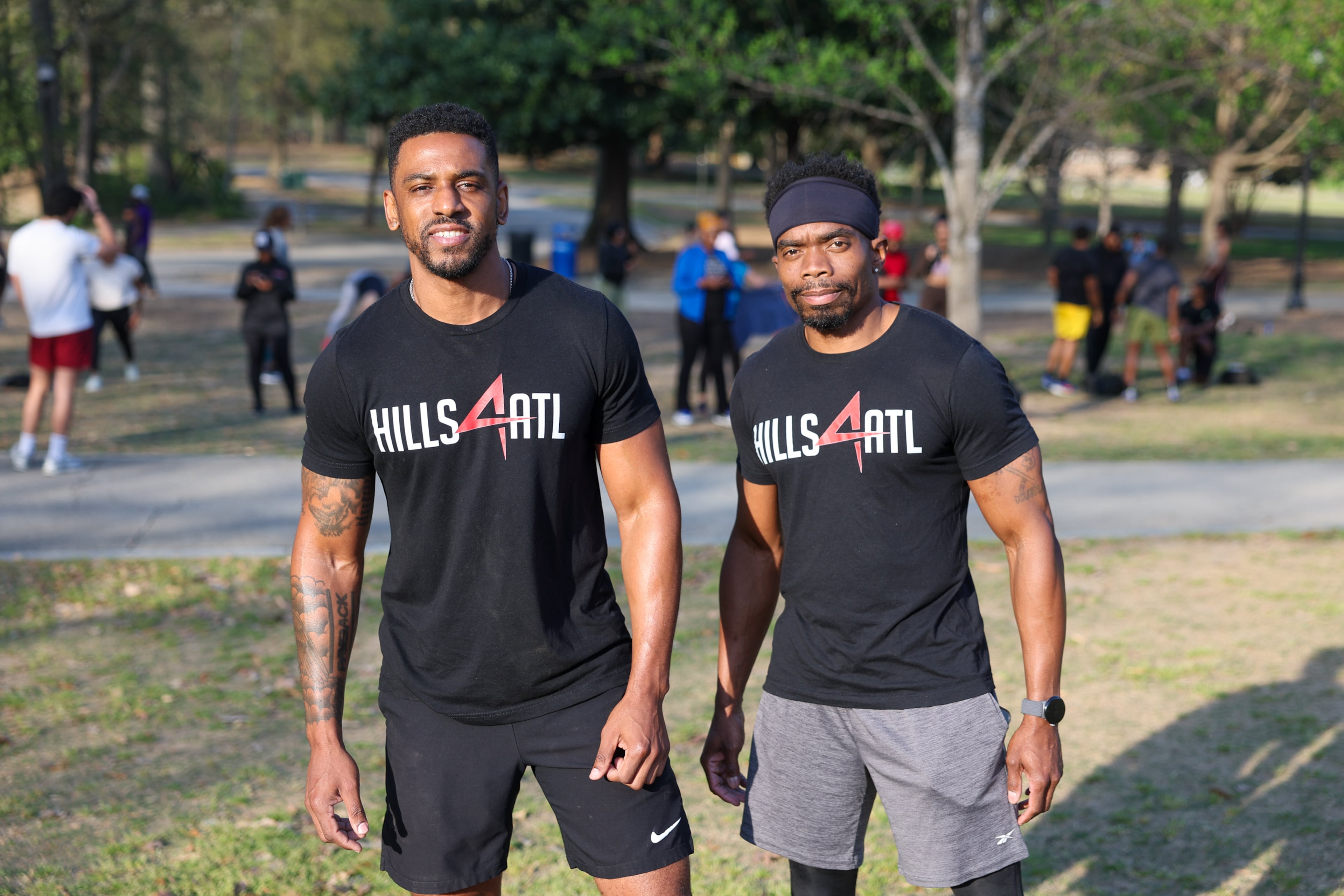 Alvin Bailey (left) and Martinas Frazier pose for a portrait before the Hills4ATL fitness group exercise event at Piedmont Park in Atlanta on Wednesday, March 25, 2026. (Arvin Temkar/AJC)