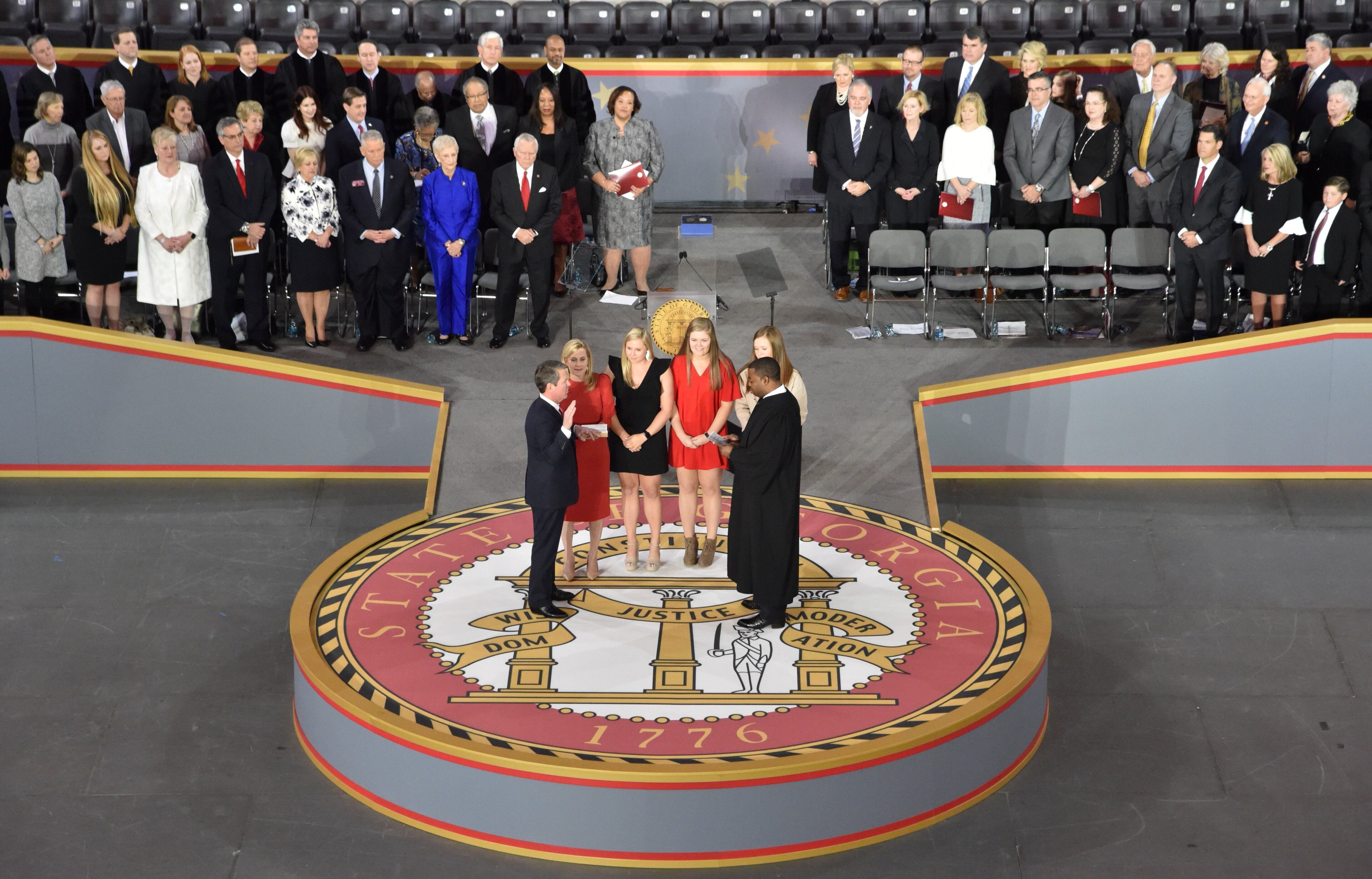 January 14, 2019 Atlanta - Brian Kemp, takes the oath of office as the 83rd governor of the state of Georgia from the Honorable T.J. Hudson during the swearing-in ceremony at McCamish Pavilion in Campus of Georgia Tech on Monday, January 14, 2019. HYOSUB SHIN / HSHIN@AJC.COM