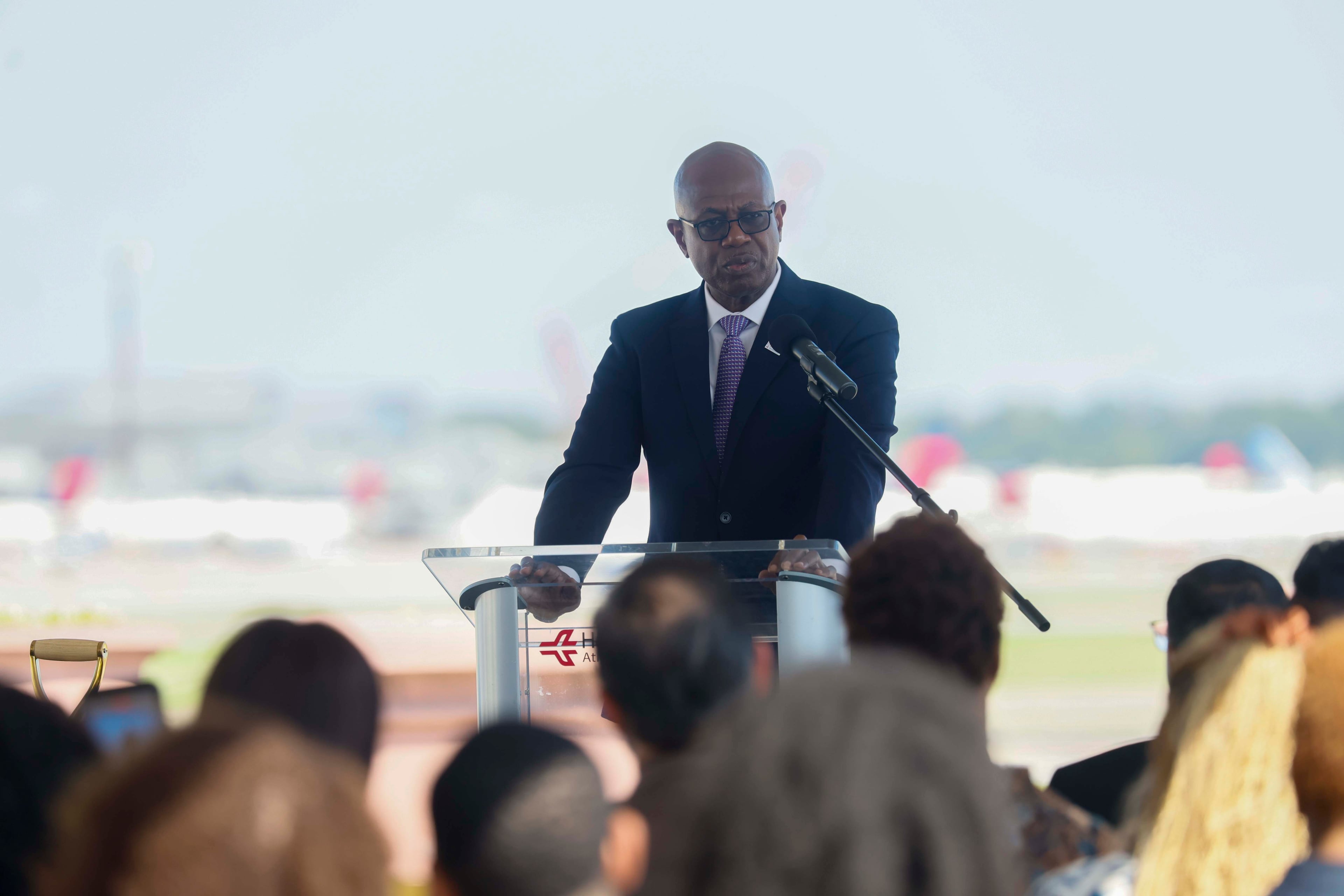 Ricky Smith, airport general manager, delivers remarks during the time capsule’s burial at Stogner Hill at Hartsfield-Jackson Atlanta International Airport on Tuesday, Sep. 8, 2026. The event commemorates ATL’s 100th anniversary. (Miguel Martinez/ AJC)