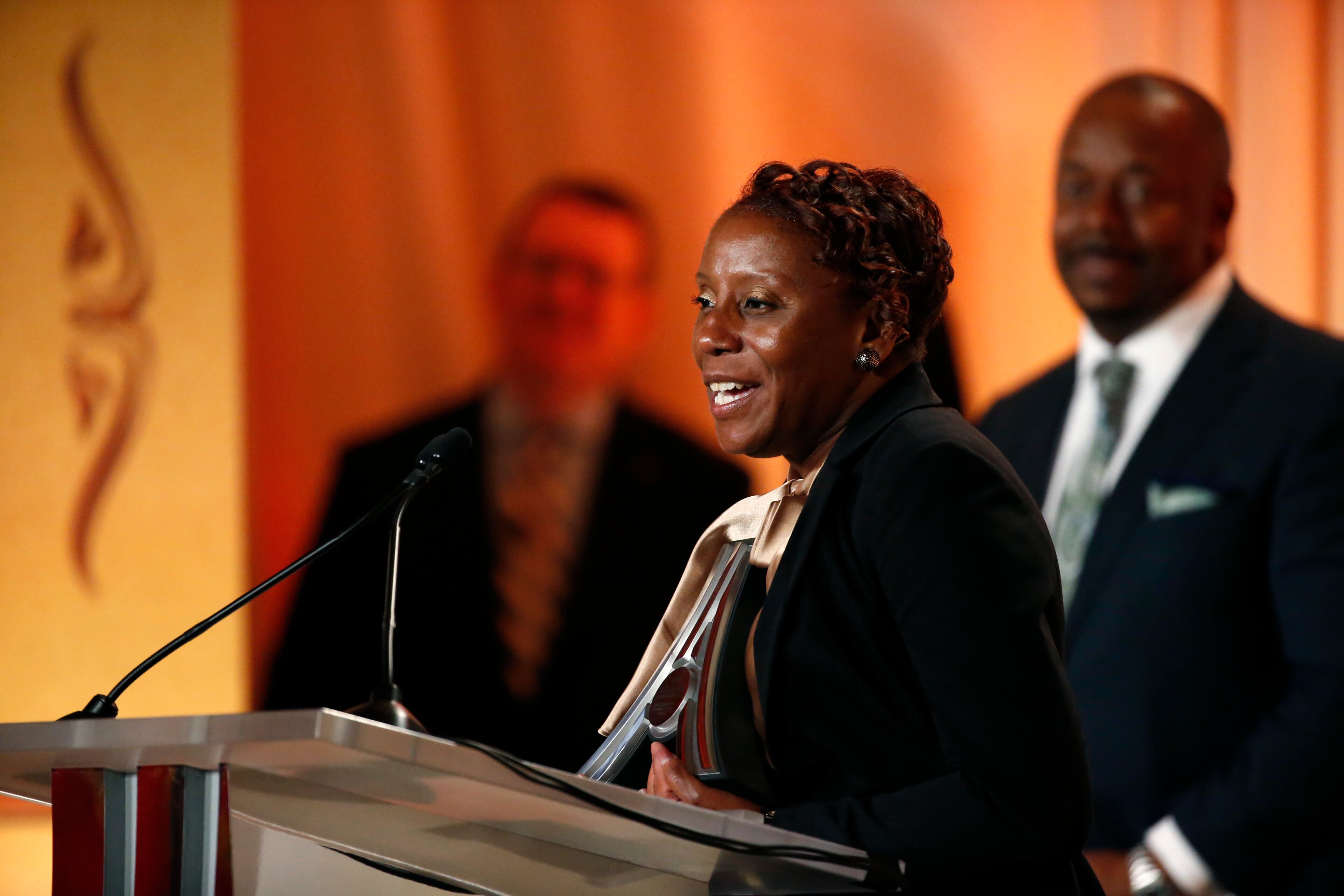 Pratina Woods receives the Community Spirit Award on behalf of her son former University of Georgia wide receiver Malcolm Mitchell during the Atlanta Sports Awards at the Fox Theatre Thursday, February 25, 2016, in Atlanta. PHOTO / JASON GETZ