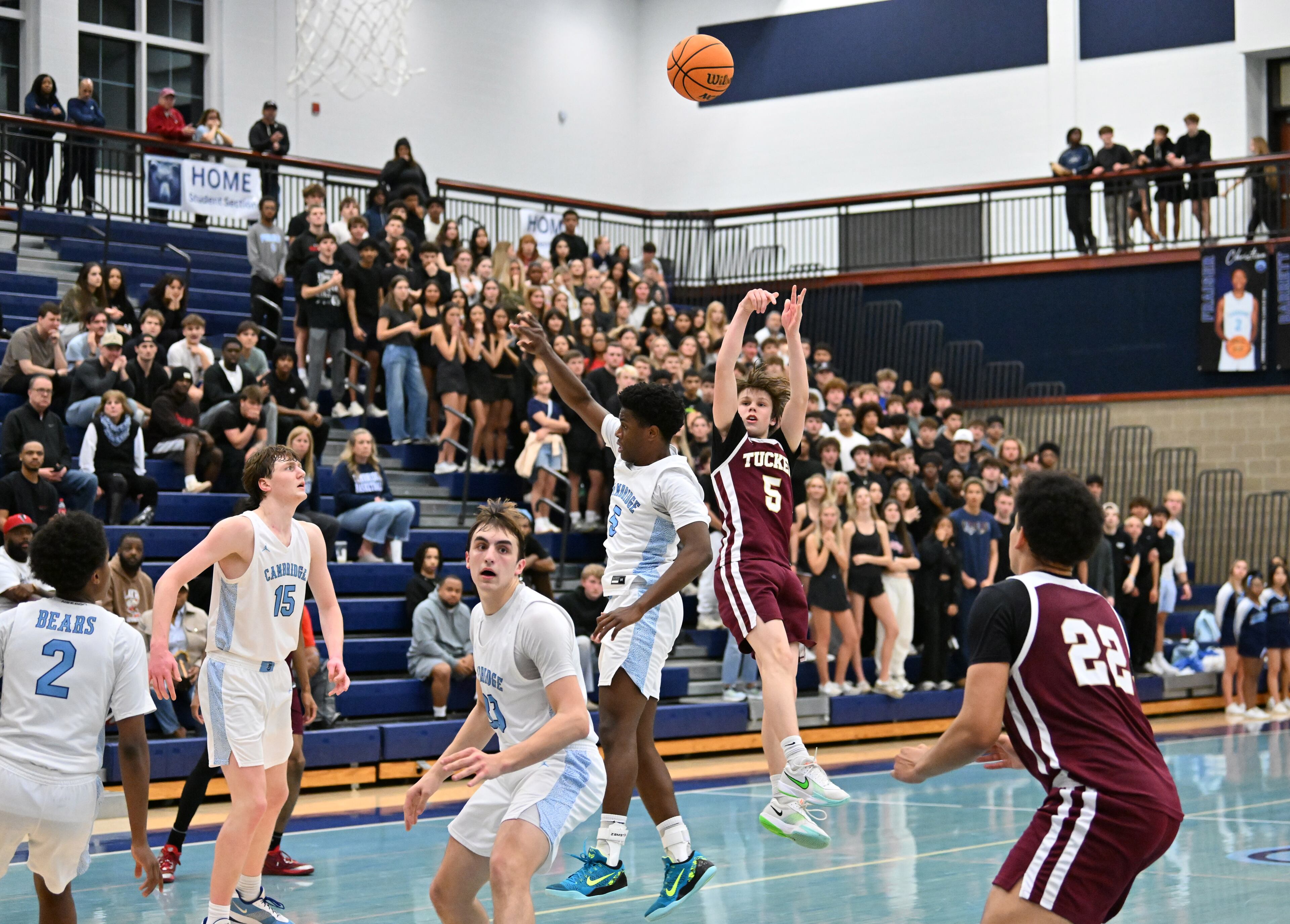 Tucker Vance Wilder Jr. (5) shoots over Cambridge Avery Joe (5) during a basketball game at Cambridge High School, Saturday, Feb. 28, 2026, in Milton. Cambridge won 58-56 over Tucker. (Hyosub Shin/AJC)