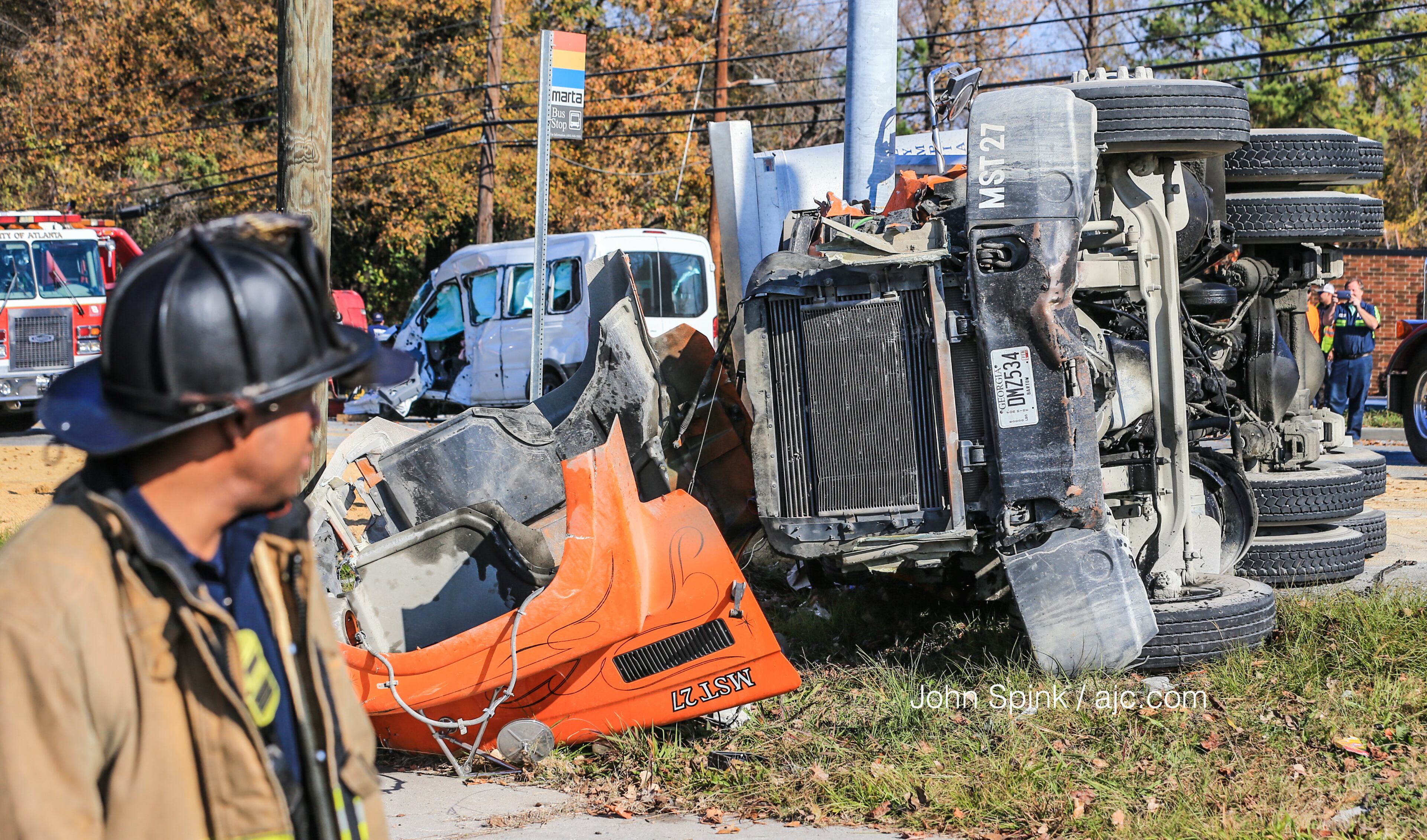 Five people were injured Monday in a crash involving a tractor-trailer and a van, authorities said. JOHN SPINK / JSPINK@AJC.COM