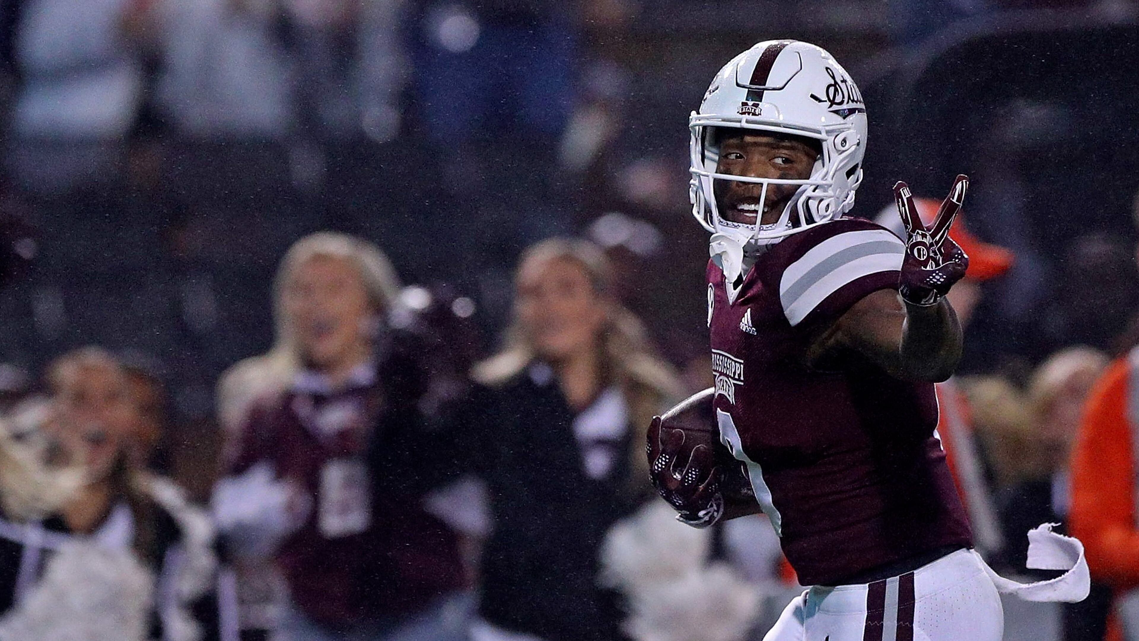 Rara Thomas of the Mississippi State Bulldogs gestures as he carries the ball during the second half against the Auburn Tigers at Davis Wade Stadium on Nov. 5, 2022, in Starkville, Miss. Thomas was arrested Monday on charges of false imprisonment and battery/family violence. (Justin Ford/Getty Images/TNS)