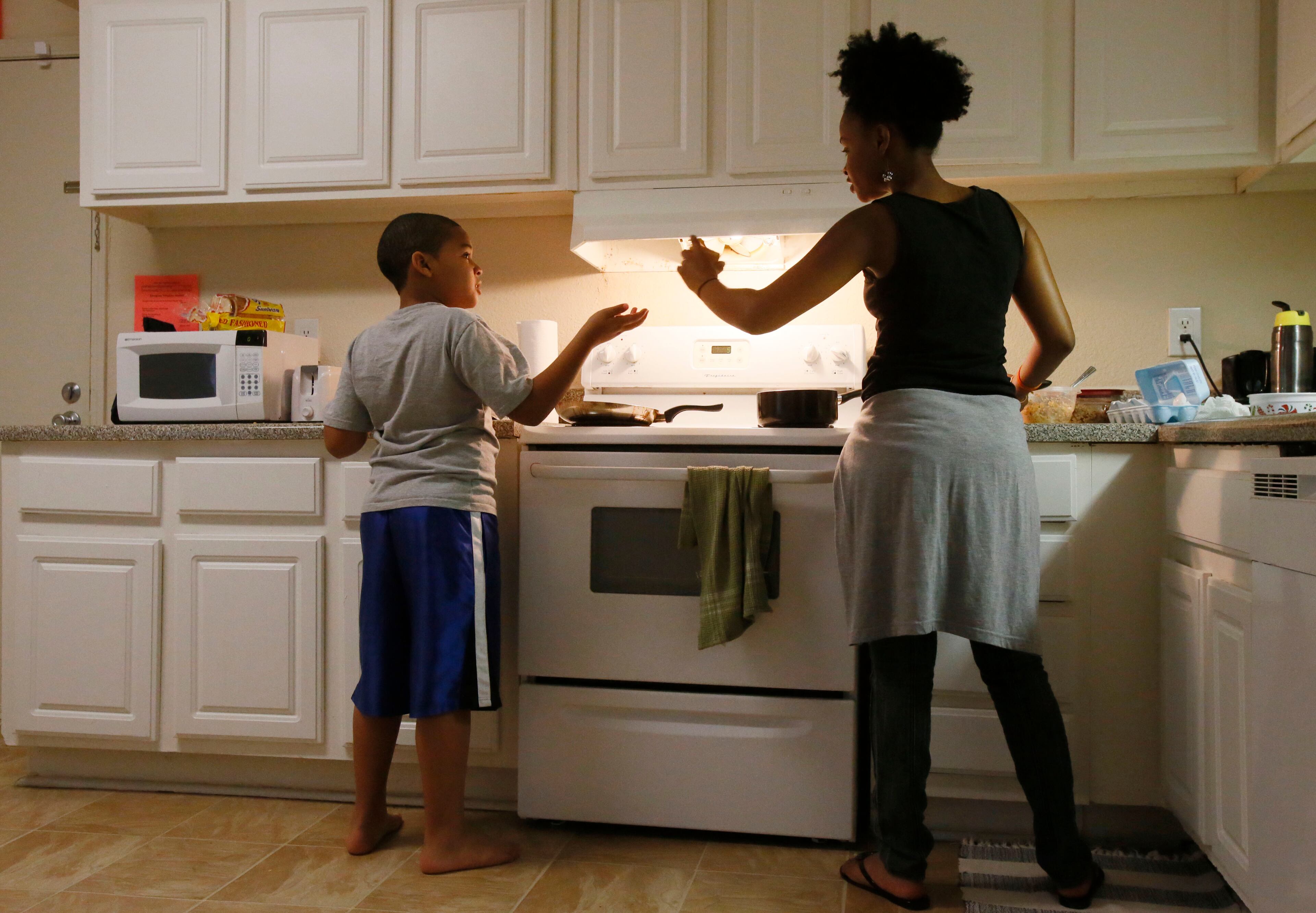 Simon and her son, Michael, 11, prepare lunch together in their two-bedroom apartment. They are living in transitional housing for women provided by Mary Hall Freedom House, a nonprofit that works to keep families intact during times of turmoil.