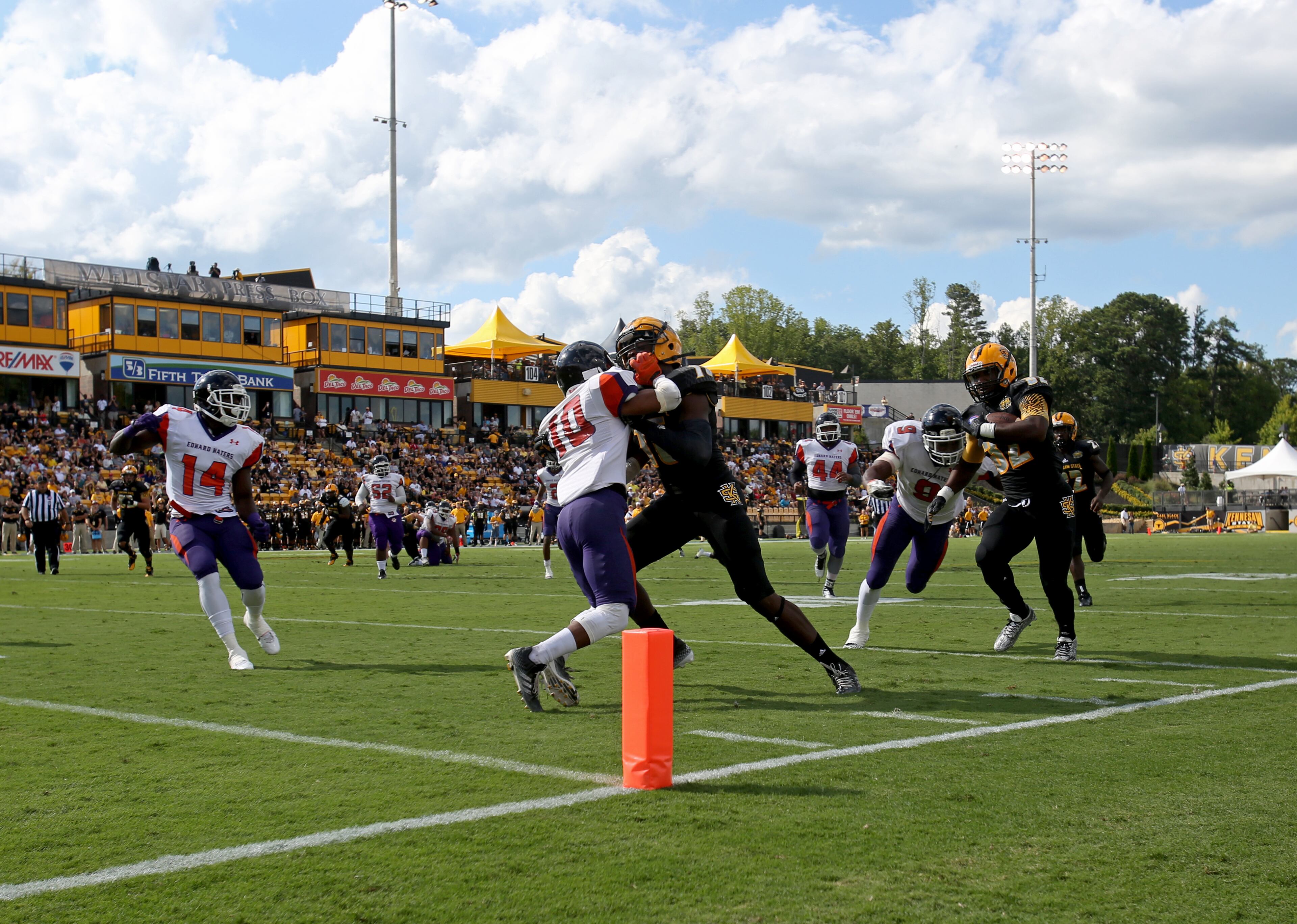 September 12, 2015 - Kennesaw, Ga: Kennesaw State University running back Jae Bowen (32, right) gets stopped short of the end zone by Edward Waters linebacker Joey Williams (9) in the first quarter of their game at Fifth Third Bank Stadium, Saturday, September 12, 2015, in Kennesaw, Ga.. This is the first home game of KSU's inaugural football season. PHOTO / JASON GETZ