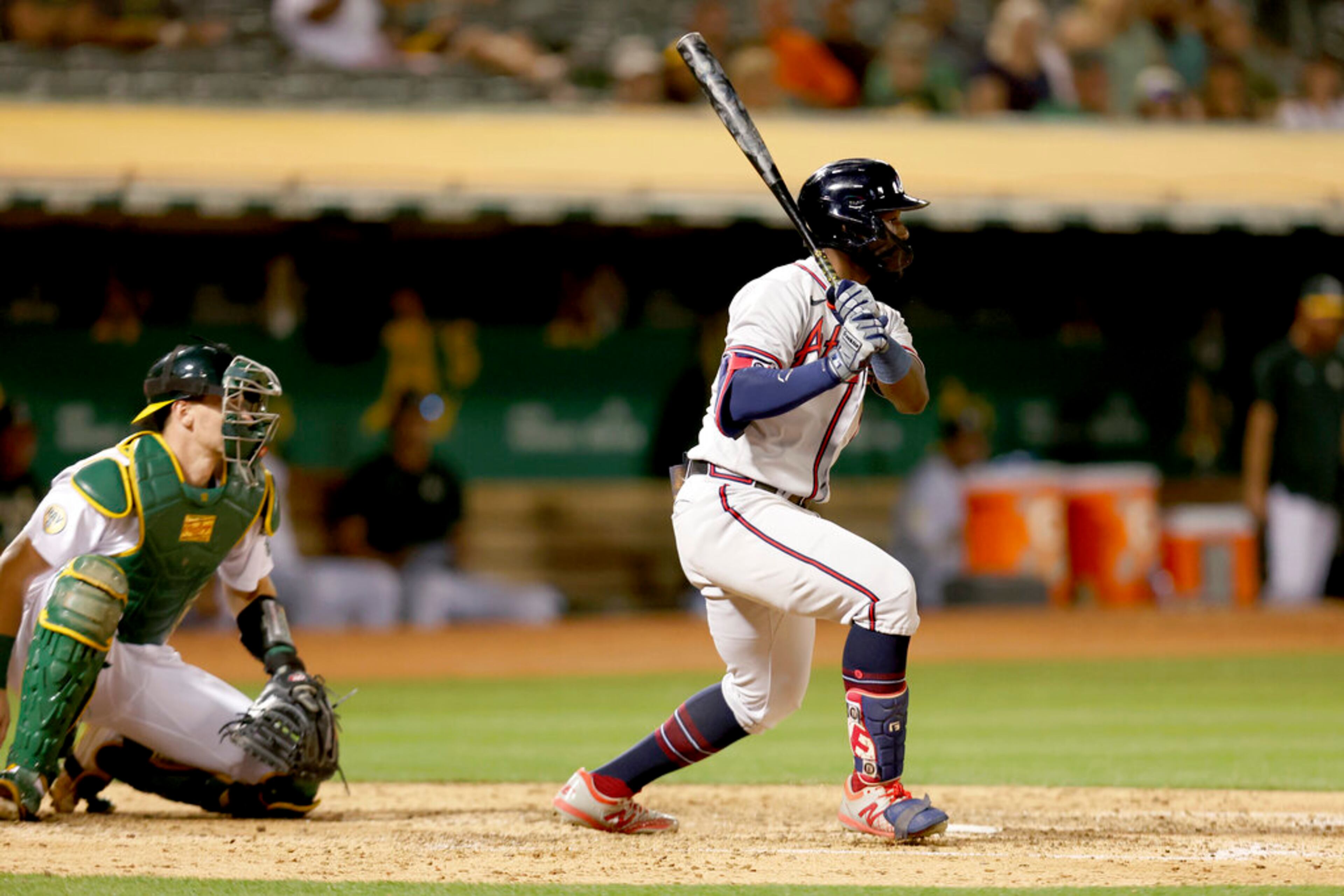 Atlanta Braves' Michael Harris II (23) watches an RBI single in front of Oakland Athletics catcher Sean Murphy, left, during the fifth inning of a baseball game in Oakland, Calif., Tuesday, Sept. 6, 2022. (AP Photo/Jed Jacobsohn)