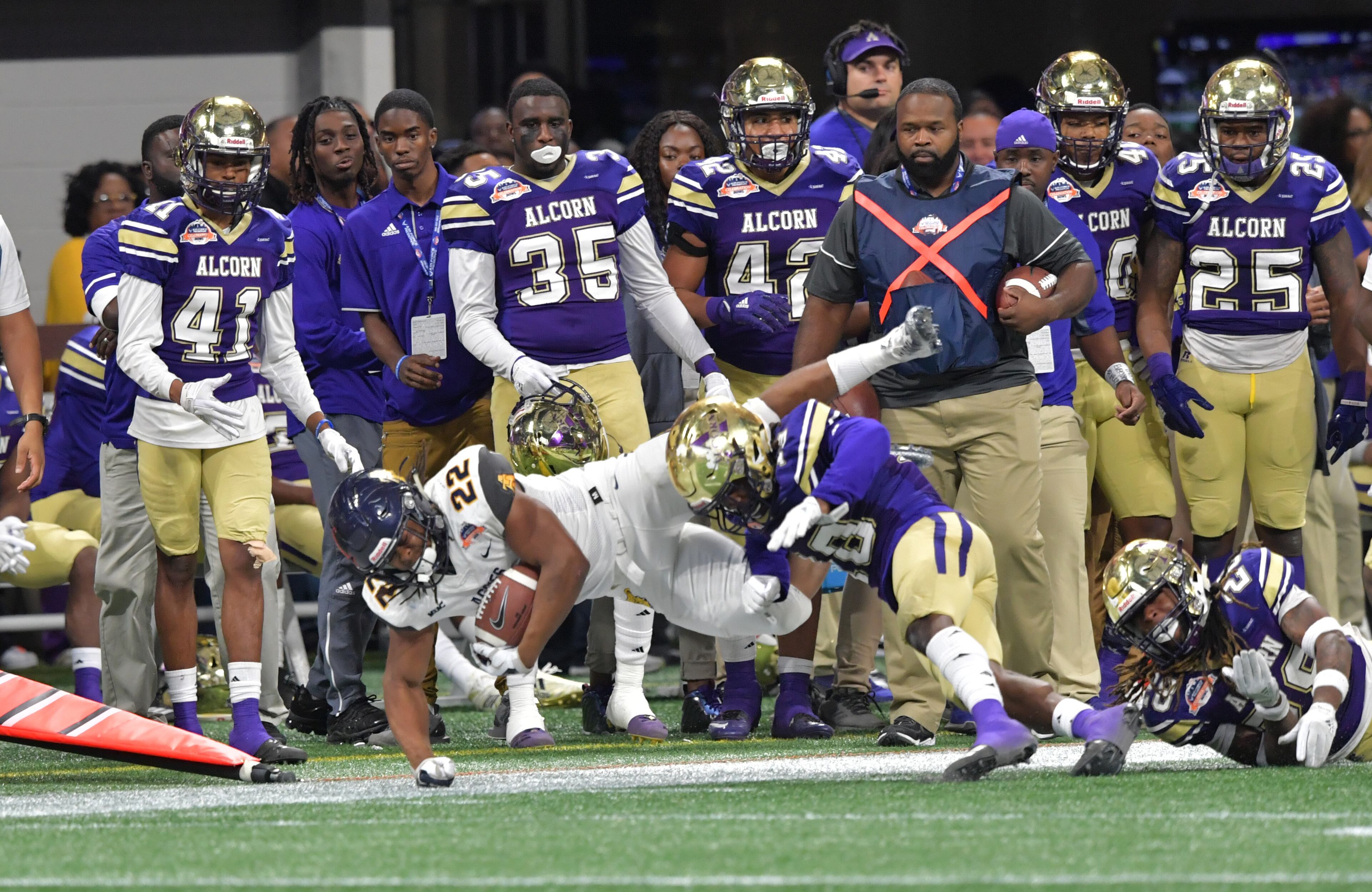 December 15, 2018 Atlanta - North Carolina A&T running back Marquell Cartwright (22) is pushed out by Alcorn State defensive back Leishaun Ealey (18) during the second half of the 2018 Celebration Bowl at Mercedes-Benz Stadium on Saturday, December 15, 2018. North Carolina A&T won 24-22 over the Alcorn State. HYOSUB SHIN / HSHIN@AJC.COM
