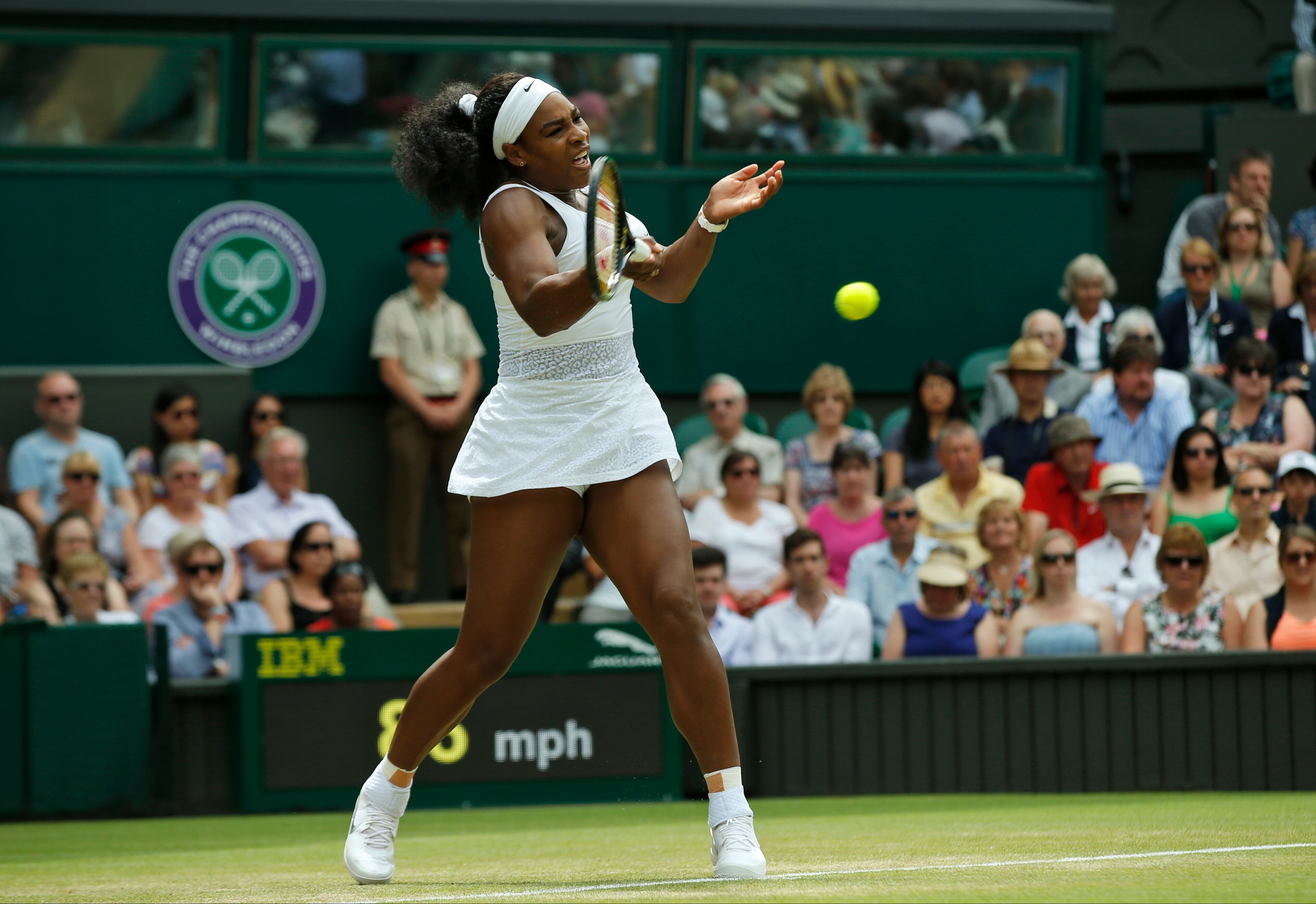 Serena Williams of the United States makes a return to Venus Williams of the United States, during their singles match against at the All England Lawn Tennis Championships in Wimbledon, London, Monday July 6, 2015. (AP Photo/Alastair Grant)