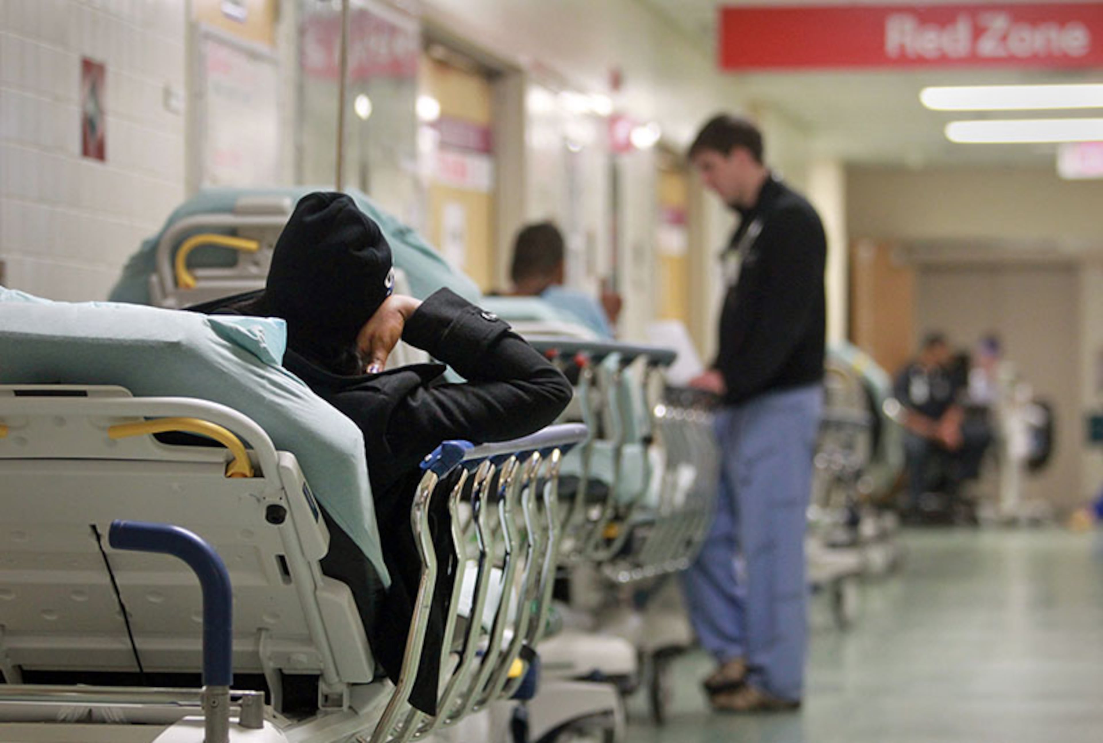 November 8, 2012 - Atlanta, Ga: A patient lays on a stretcher as they wait to be treated in the Red Zone of the Grady Emergency Room at Grady Memorial Hospital Thursday morning in Atlanta, Ga., November 8, 2012. In 2012, Georgia received more than $275 million in federal funds to help hospitals, such as Grady, at least partly make up for the money they lose caring for the poor and uninsured. But much of that money is expected to go away starting in 2014 as part of a requirement under the Affordable Care Act - a move that experts say could threaten the financial stability of Georgia's safety net hospitals. JASON GETZ / JGETZ@AJC.COM
