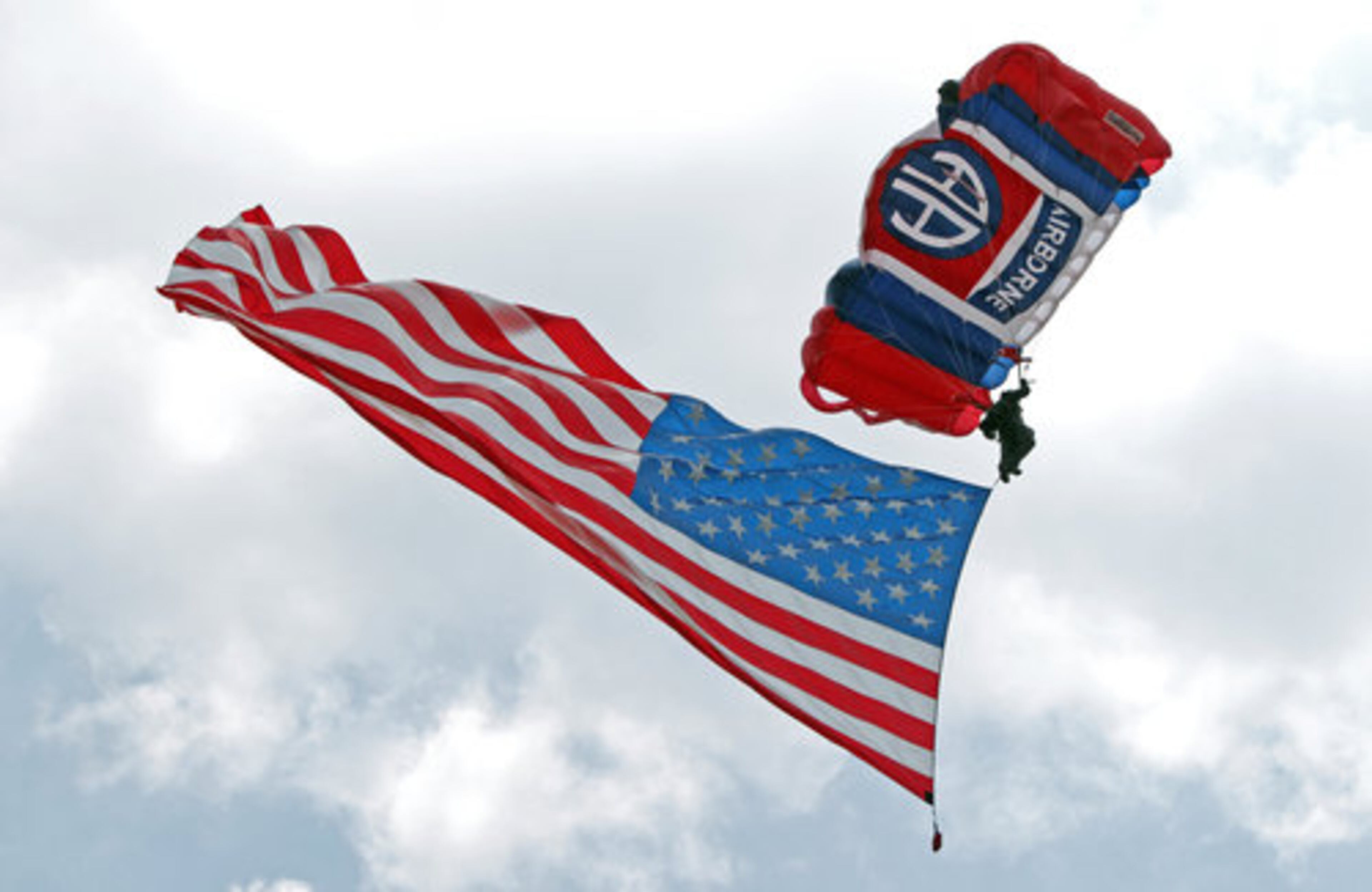 A skydiver flies in the U.S. flag to mark the start of the 2011 Good Neighbor Day Air Show at the DeKalb Peachtree Airport Saturday afternoon.