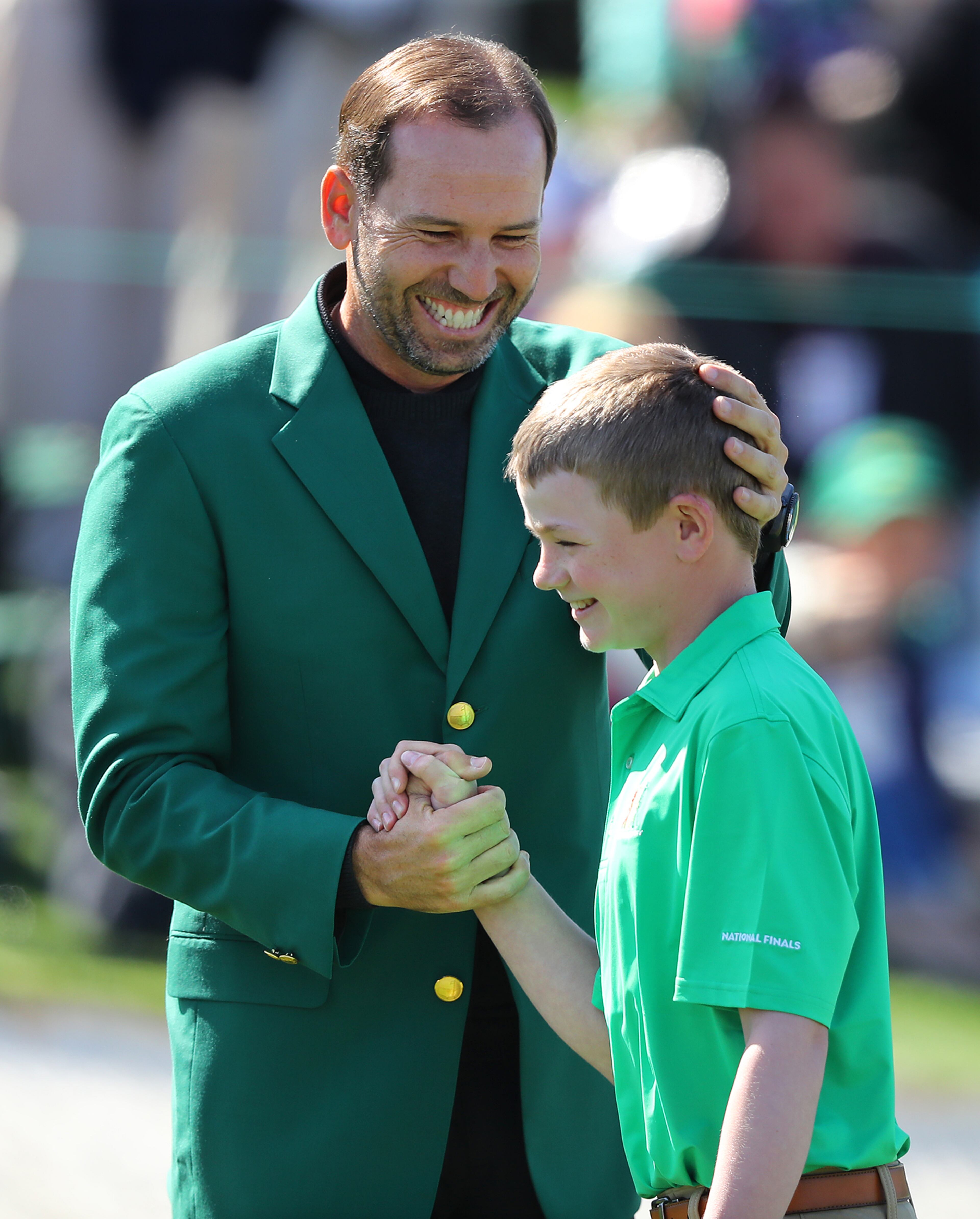 April 1, 2018 Atlanta: Defending Masters champion Sergio Garcia gives Nicholas Gross, Downington, PA, five after his putt on the 18th green to win the putting championship for 10-11 boys during the Drive Chip Putt National Finals at Augusta National Golf Club on Sunday, April 1, 2018, in Augusta. Curtis Compton/ccompton@ajc.com