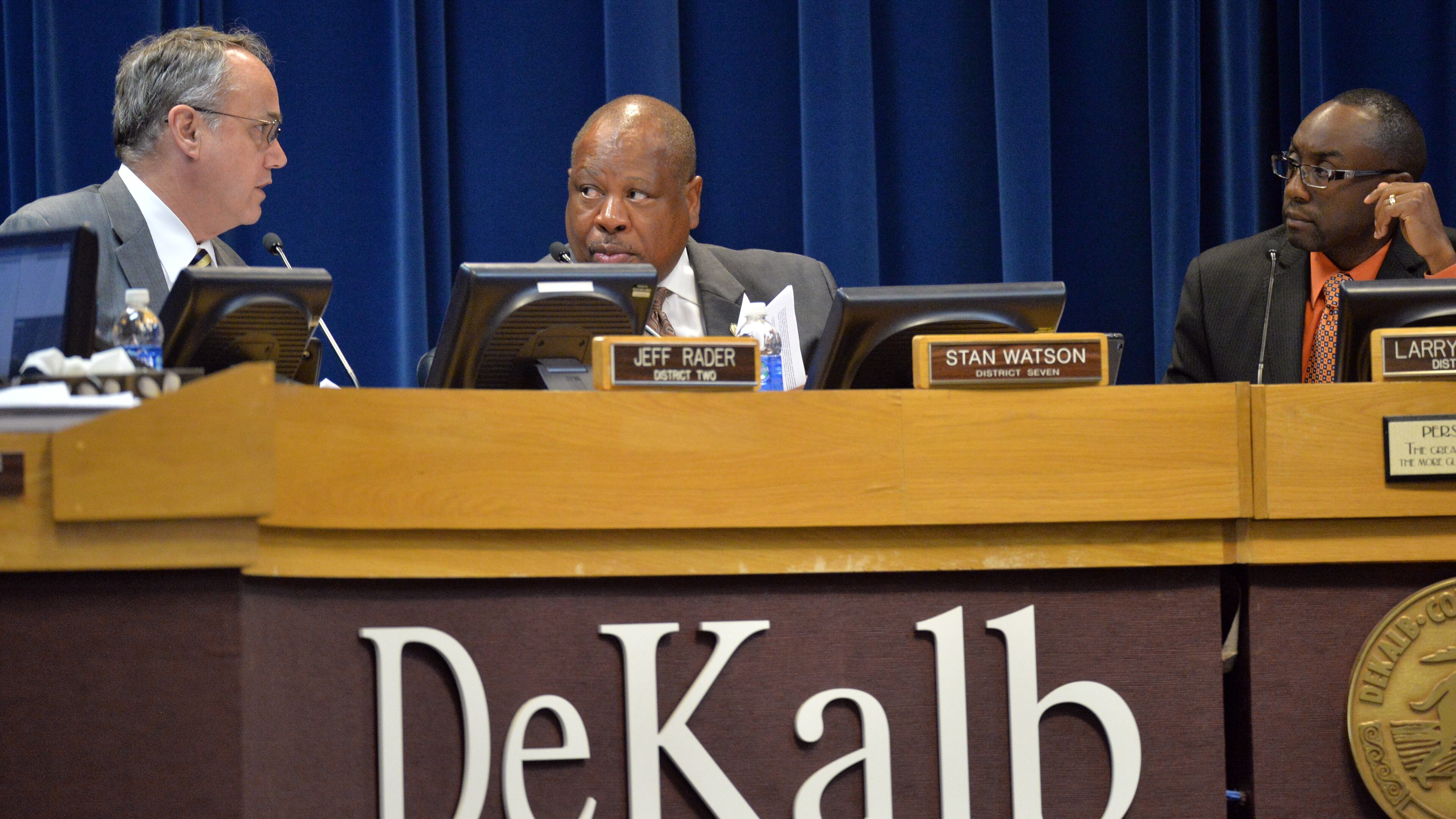 August 26, 2014 Decatur - DeKalb County commissioner Stan Watson (center) confers with commissioner Jeff Rader (left) as commissioner Larry Johnson looks during a meeting at Dekalb County Government Administration Building in Decatur on Tuesday, August 26, 2014. A day after resigning from office, DeKalb County Commissioner Elaine Boyer announced in court Tuesday she pleaded guilty to federal charges accusing her of two schemes to pocket tens of thousands of dollars from taxpayers. HYOSUB SHIN / HSHIN@AJC.COM DeKalb Commissioners Jeff Rader, Stan Watson and Larry Johnson. (HYOSUB SHIN / HSHIN@AJC.COM)