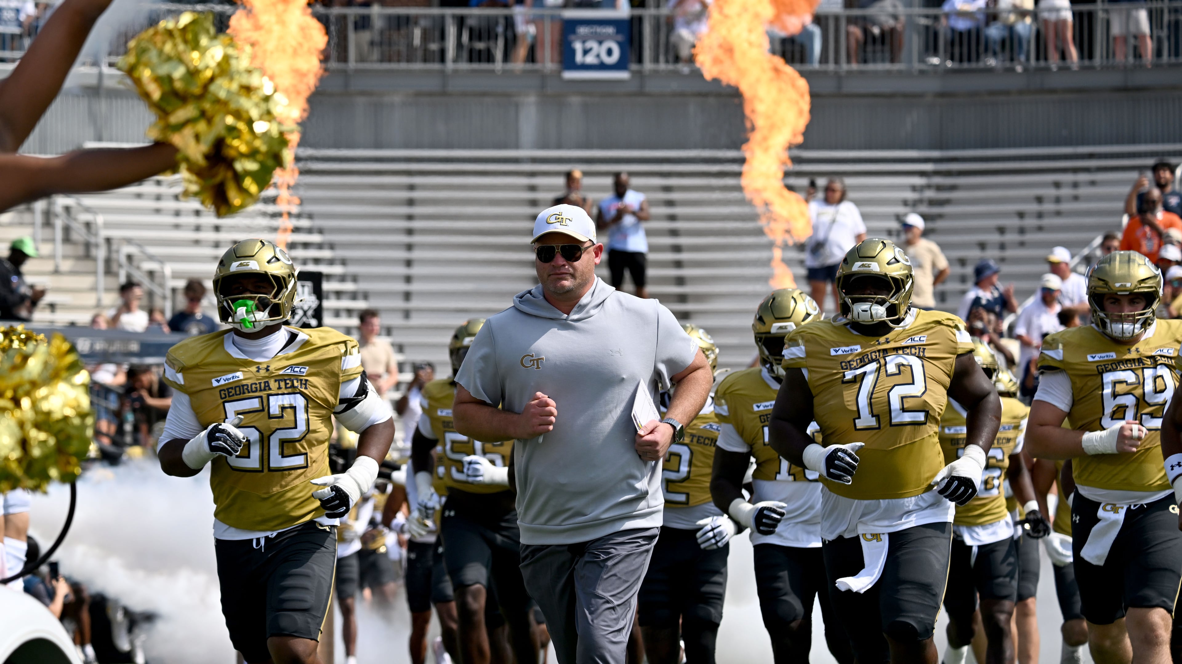 Georgia Tech head coach Brent Key and players run onto the field before the start of the Georgia Tech home game against Mercer at Bobby Dodd Stadium on Saturday, Sept. 19, 2026, in Atlanta. (Hyosub Shin/AJC)