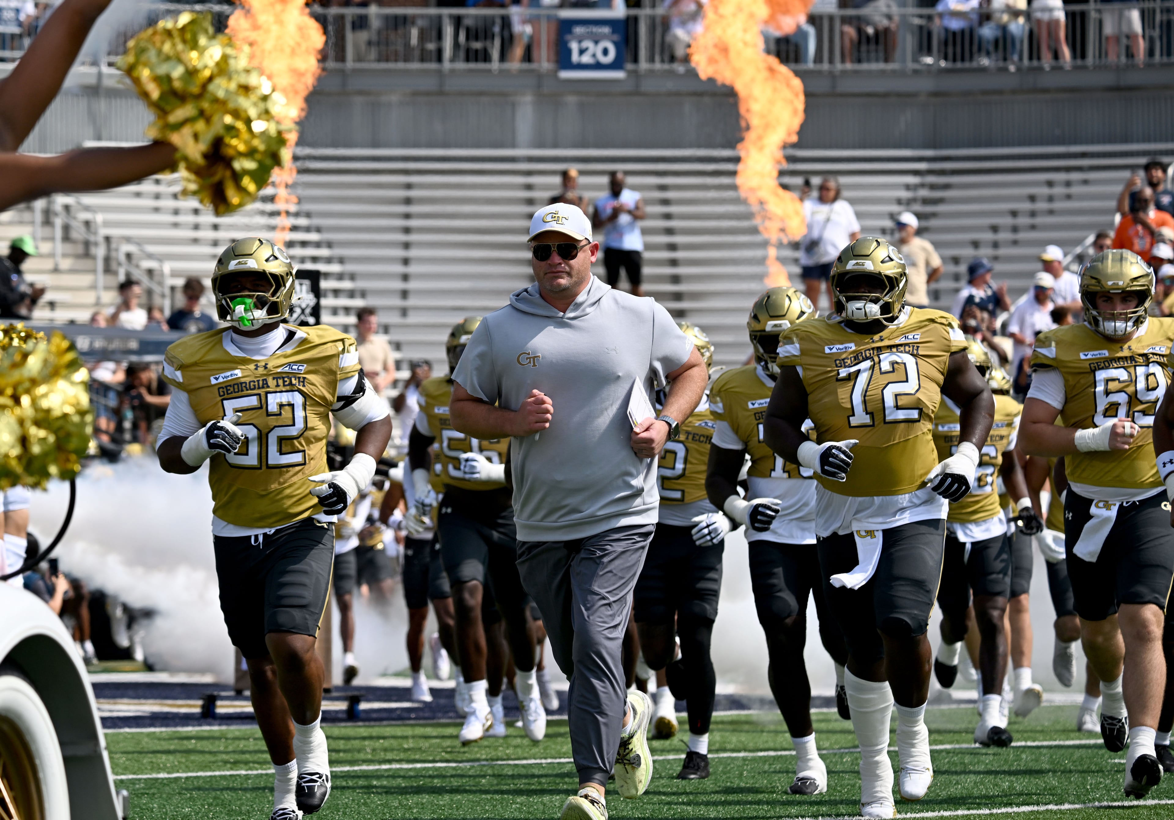 Georgia Tech head coach Brent Key and players run onto the field before the start of the Georgia Tech home game against Mercer at Bobby Dodd Stadium on Saturday, Sept. 19, 2026, in Atlanta. (Hyosub Shin/AJC)