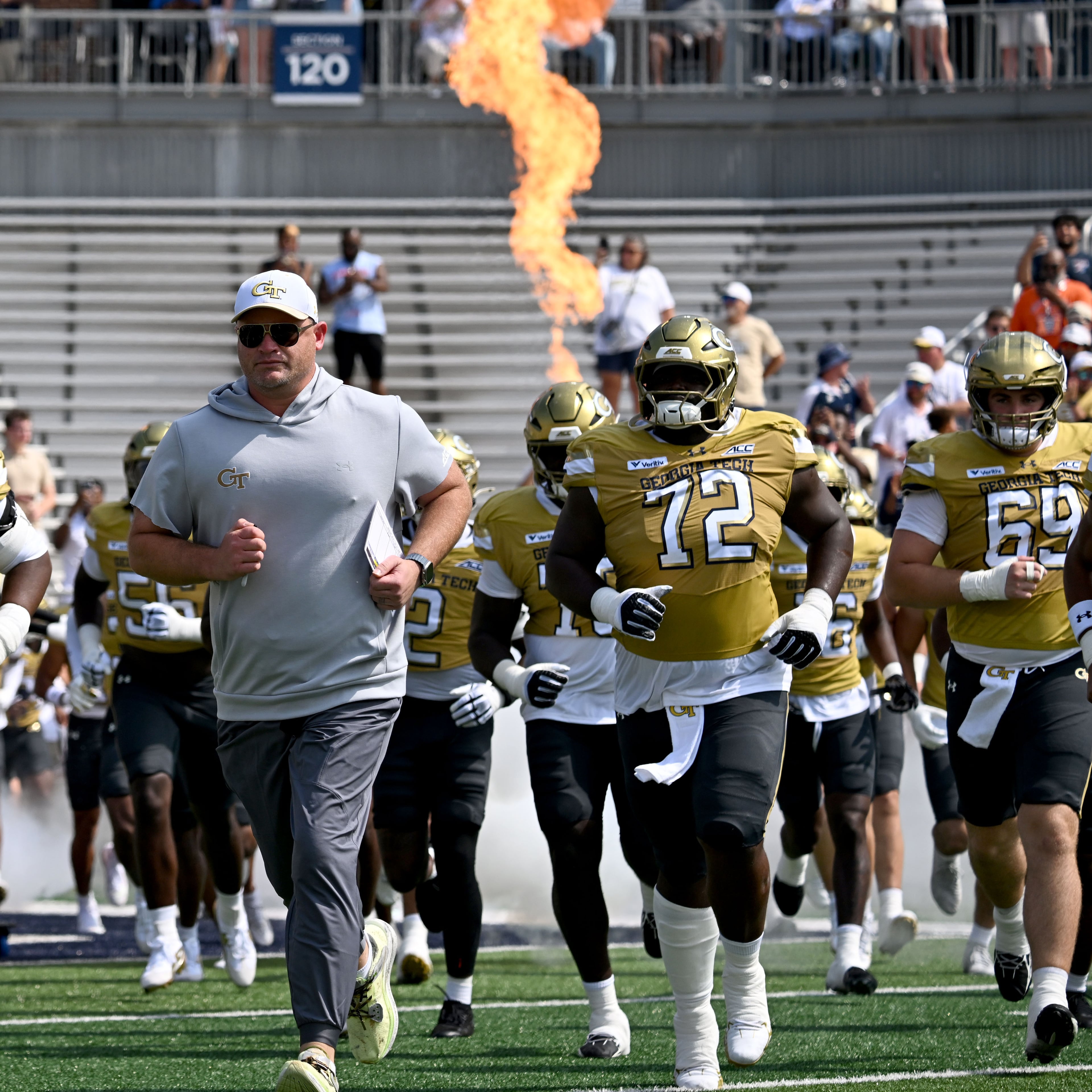 Georgia Tech head coach Brent Key and players run onto the field before the start of the Georgia Tech home game against Mercer at Bobby Dodd Stadium on Saturday, Sept. 19, 2026, in Atlanta. (Hyosub Shin/AJC)