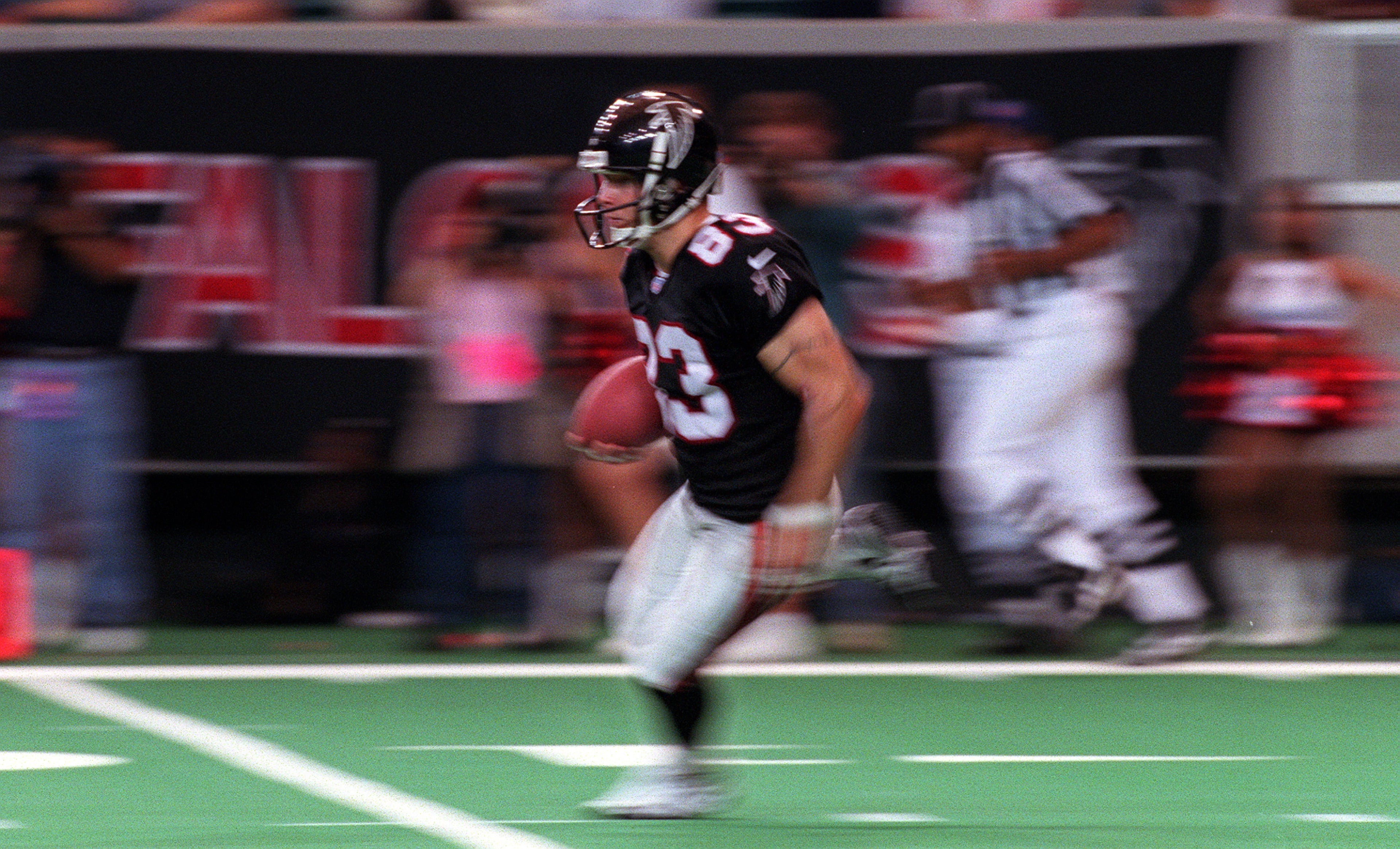 Falcons' Tim Dwight returns a kick.