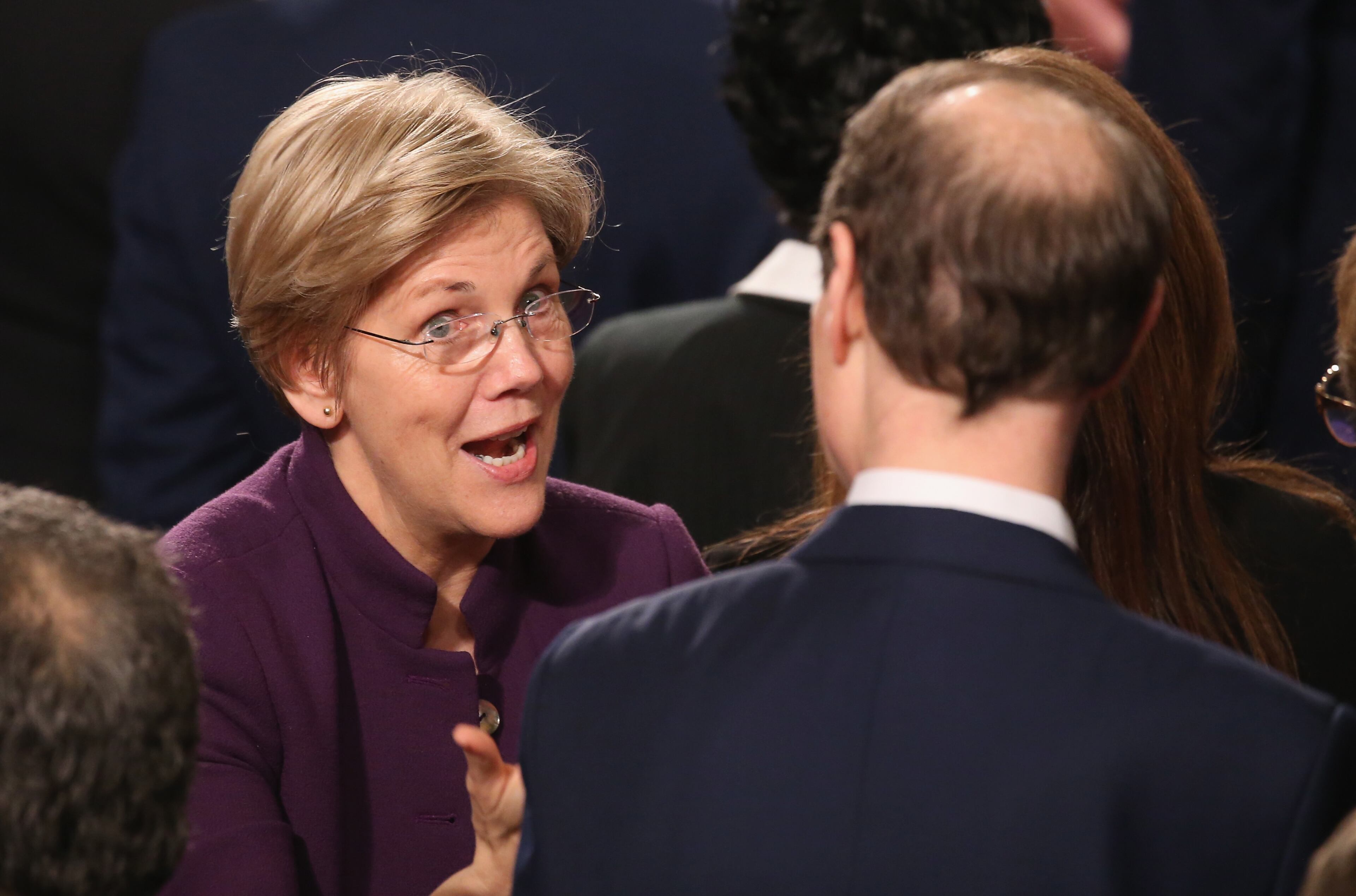 Sen. Elizabeth Warren (D-MA) speaks with members of congress before President Barack Obama delivers the State of the Union speech before members of Congress in the House chamber of the U.S. Capitol January 12, 2016 in Washington, DC. (Photo by Mark Wilson/Getty Images)