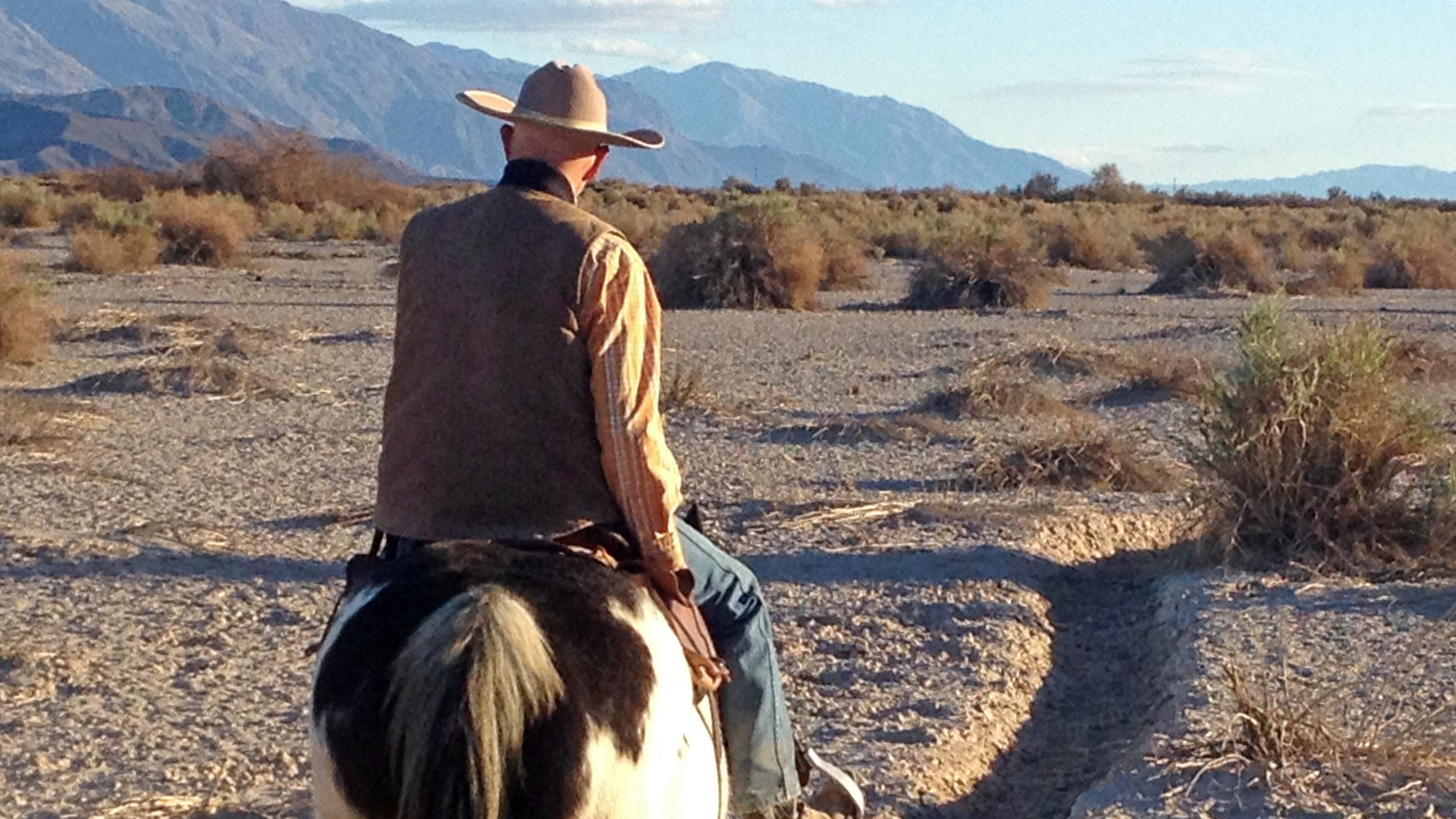 The guide takes the lead during a horseback ride on the valley floor in Death Valley. (Marjie Lambert/Miami Herald/TNS)