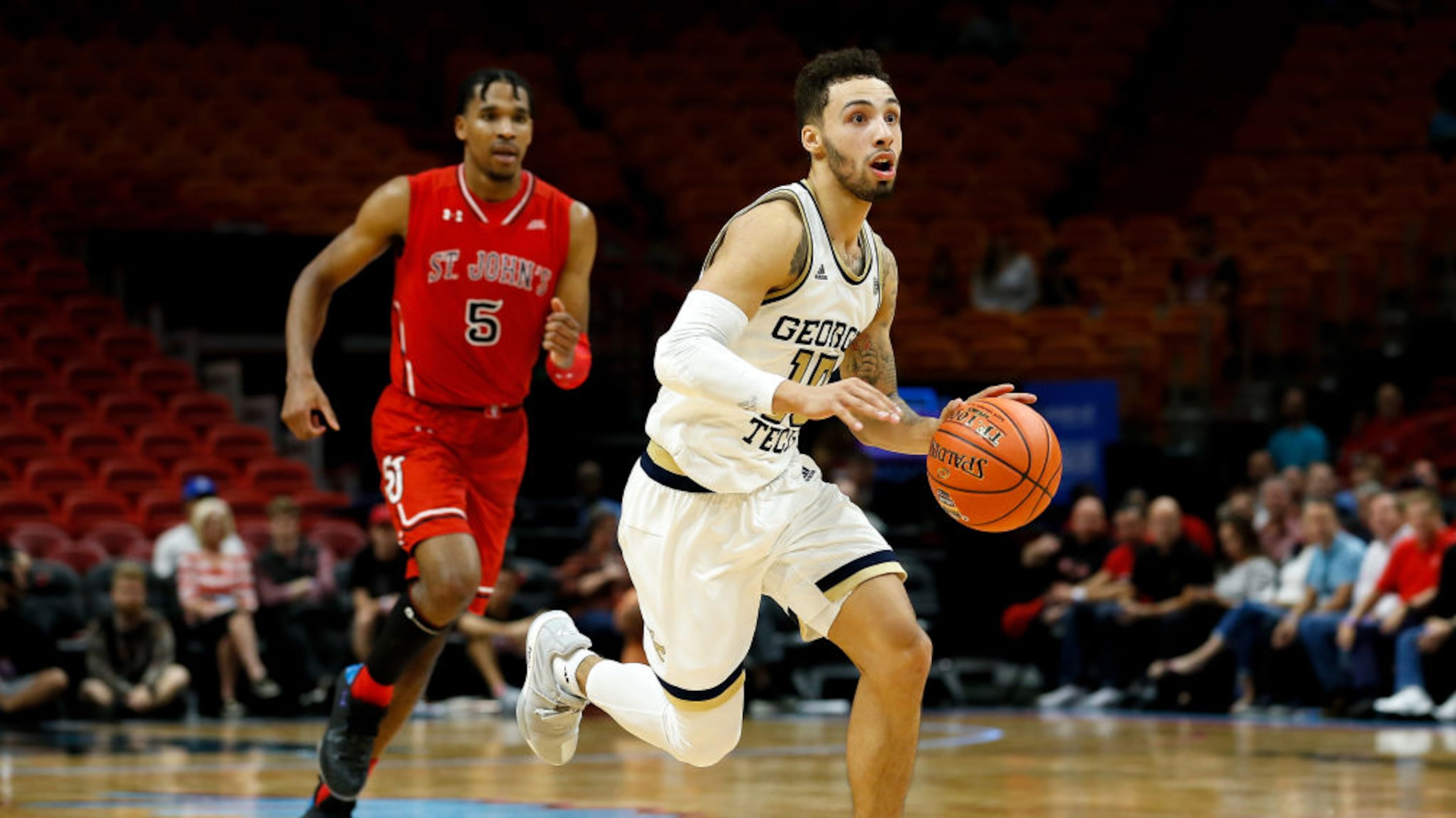 MIAMI, FL - DECEMBER 01: Jose Alvarado #10 of the Georgia Tech Yellow Jackets drives to the basket against Justin Simon #5 of the St. John's Red Storm during the HoopHall Miami Invitational at American Airlines Arena on December 1, 2018 in Miami, Florida. (Photo by Michael Reaves/Getty Images)