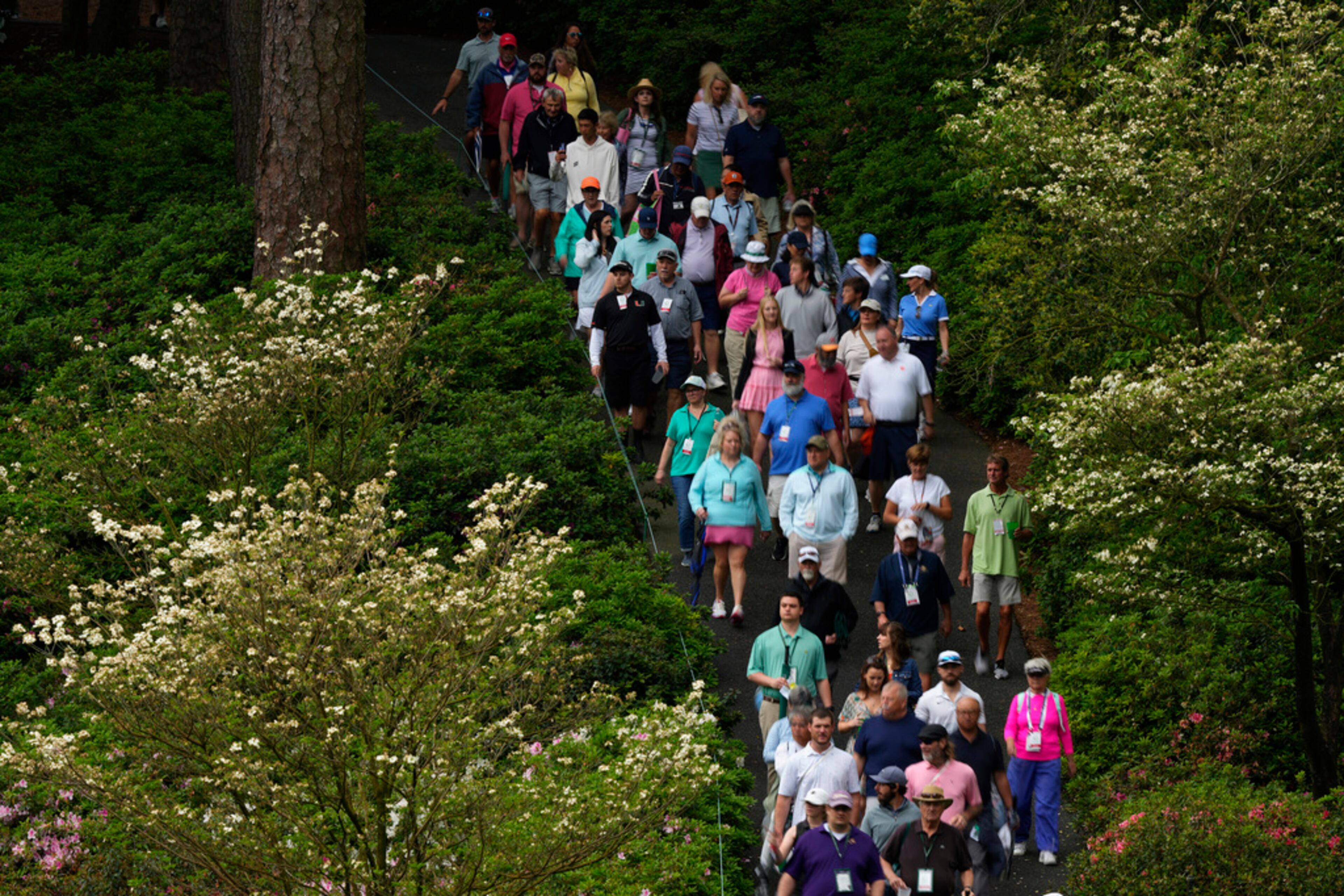 Patrons walk down the sixth hole during the final round of the Augusta National Women's Amateur golf tournament, Saturday, April 1, 2023, in Augusta, Ga. (AP Photo/Matt Slocum)