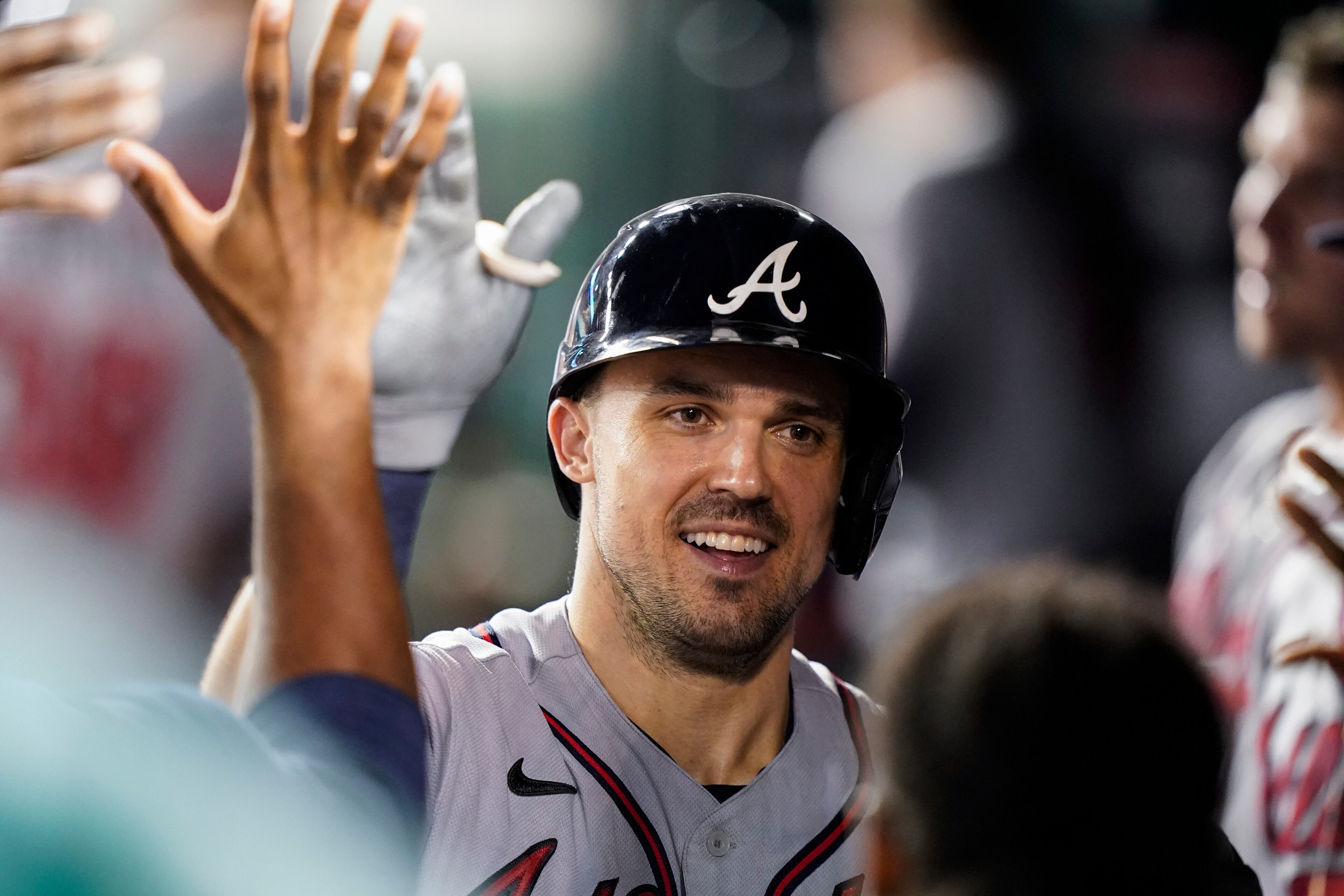Atlanta Braves' Adam Duvall (14) celebrates his solo home run during the ninth inning of a baseball game against the Washington Nationals at Nationals Park, Saturday, Aug. 14, 2021, in Washington. The Braves won 12-2. (AP Photo/Alex Brandon)