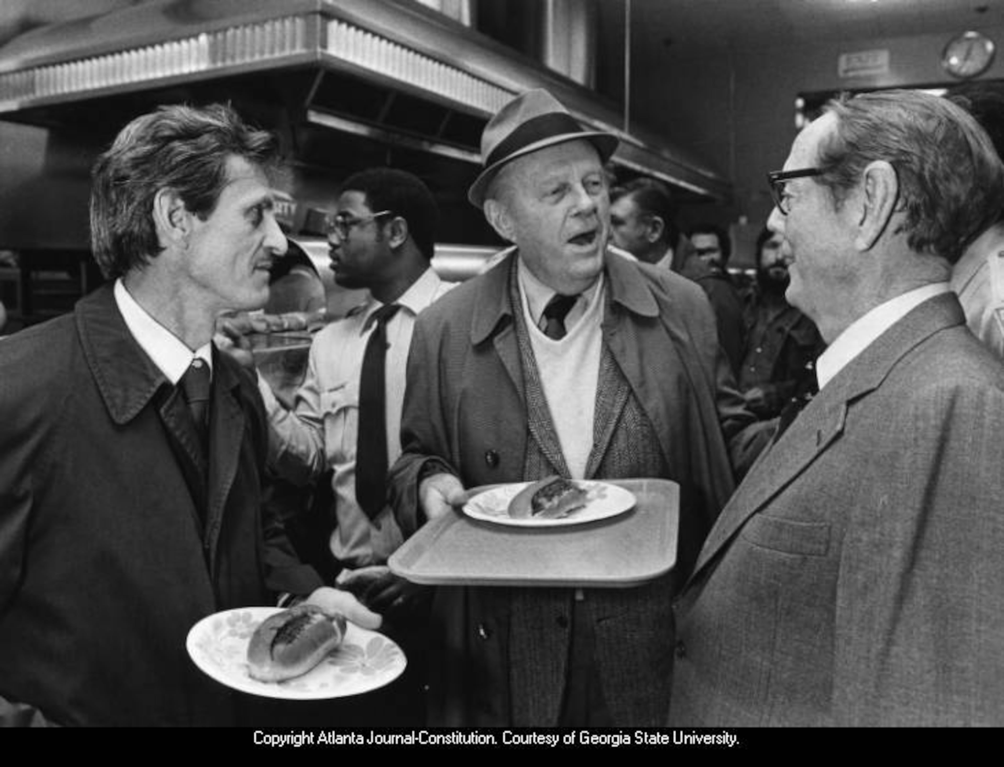 Dec. 1, 1981 -- Varsity founder Frank Gordy (right) greets customers as he did daily since 1928. W.A. BRIDGES JR. / AJC PHOTO ARCHIVES