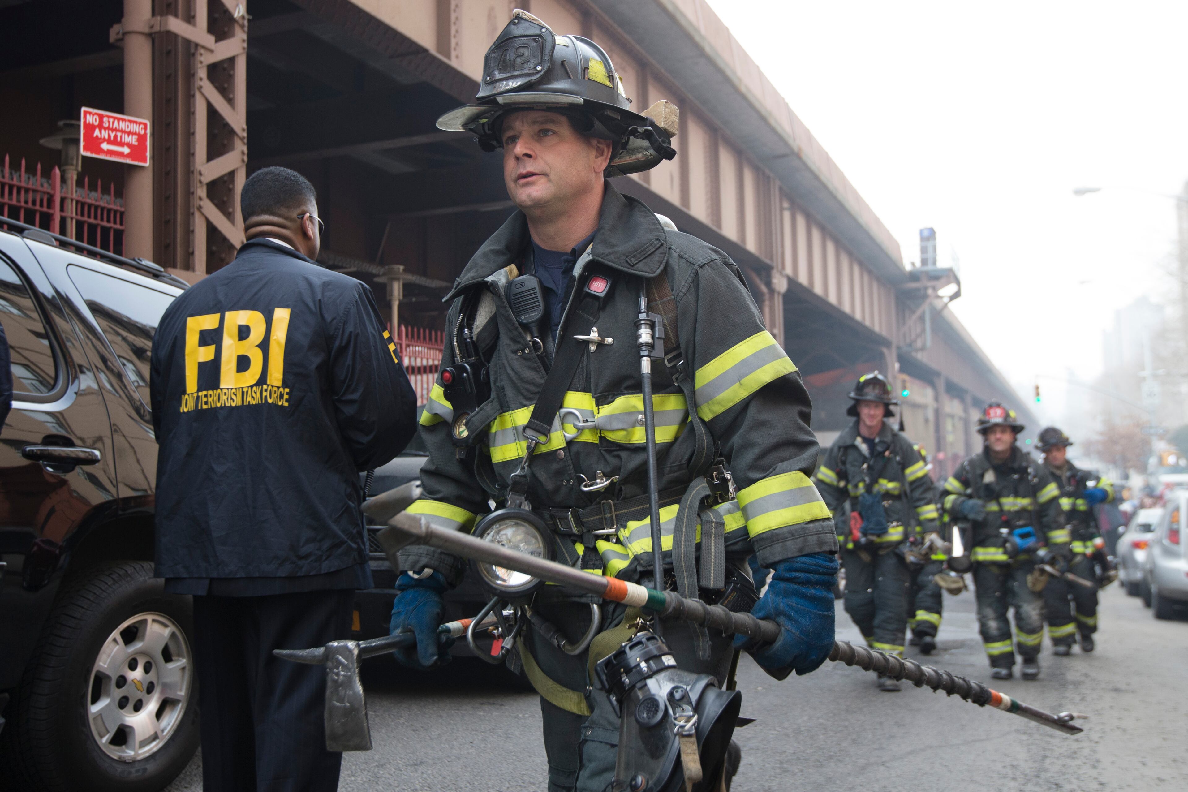 Firefighters respond after an explosion and building collapse in the East Harlem neighborhood of New York, Wednesday, March 12, 2014. The explosion leveled an apartment building, and sent flames and billowing black smoke above the skyline. (AP Photo/John Minchillo)