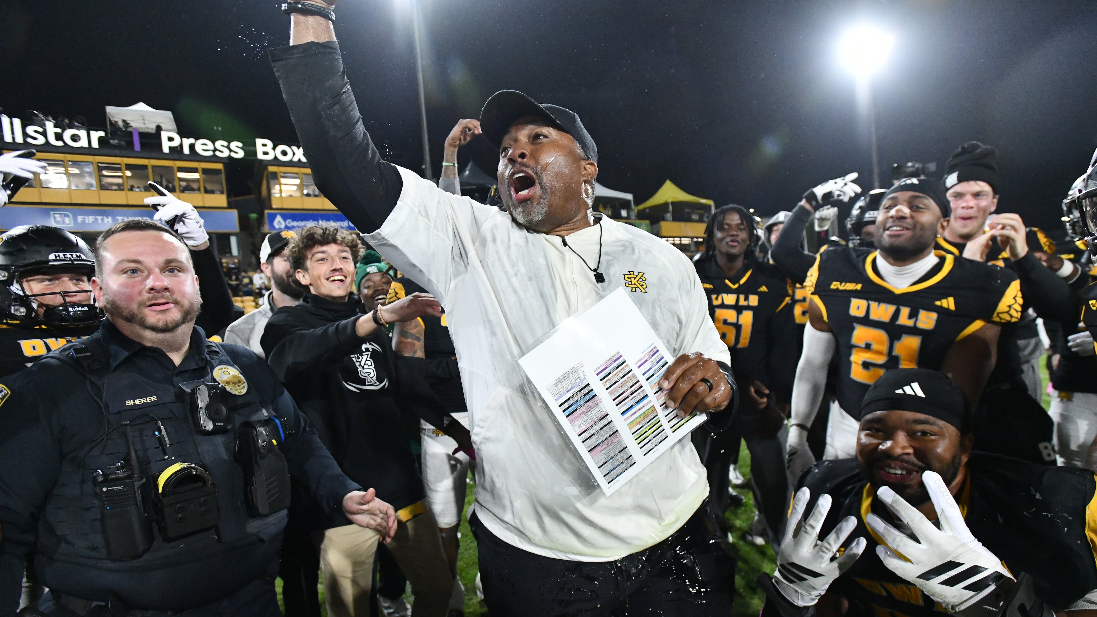 Kennesaw State head coach Jerry Mack celebrates with players after Kennesaw State beat UTEP during an NCAA college football game at Fifth Third Stadium, Tuesday, Oct. 28, 2025, in Kennesaw. (Hyosub Shin/AJC)